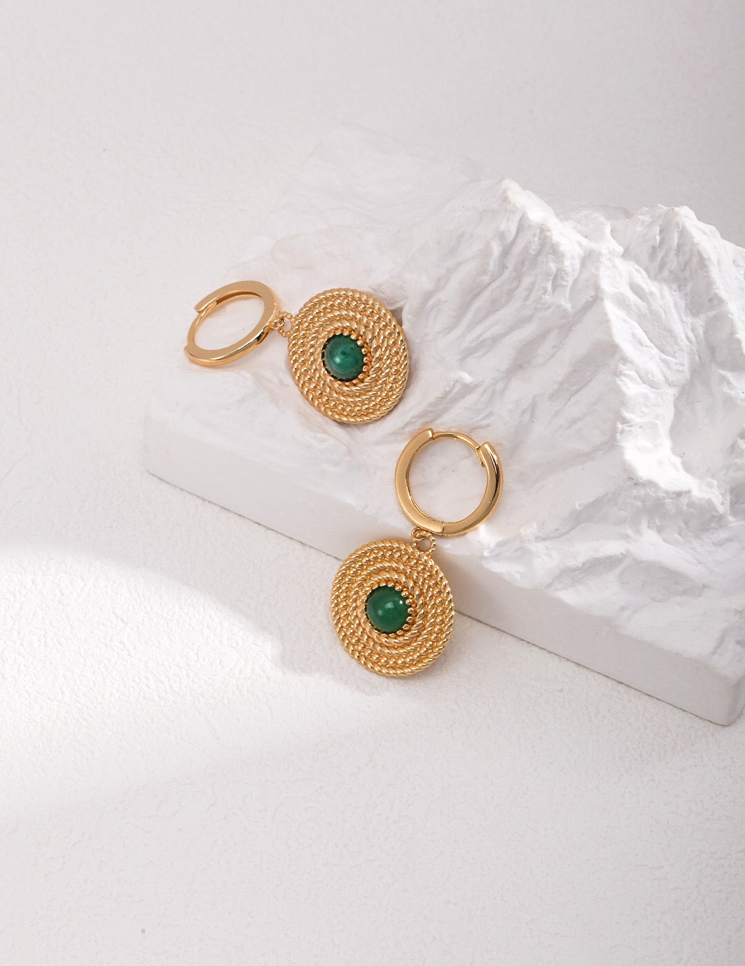 A pair of handmade Round Green Pith Earrings featuring gold vermeil accents, showcasing their unique design and vibrant color.