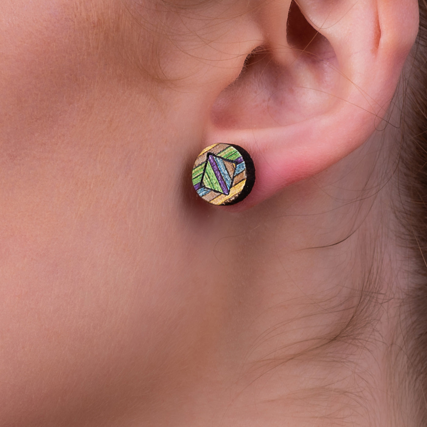 Roundmix Recycled Skateboard Stud Earrings showcasing vibrant colors and unique patterns from upcycled skateboards.