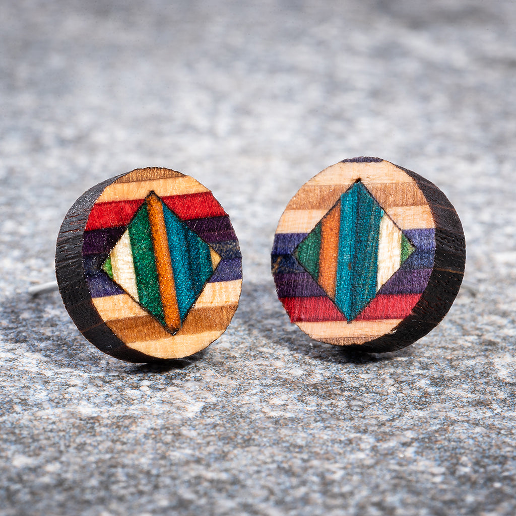 Roundmix Recycled Skateboard Stud Earrings showcasing vibrant colors and unique patterns from upcycled skateboards.