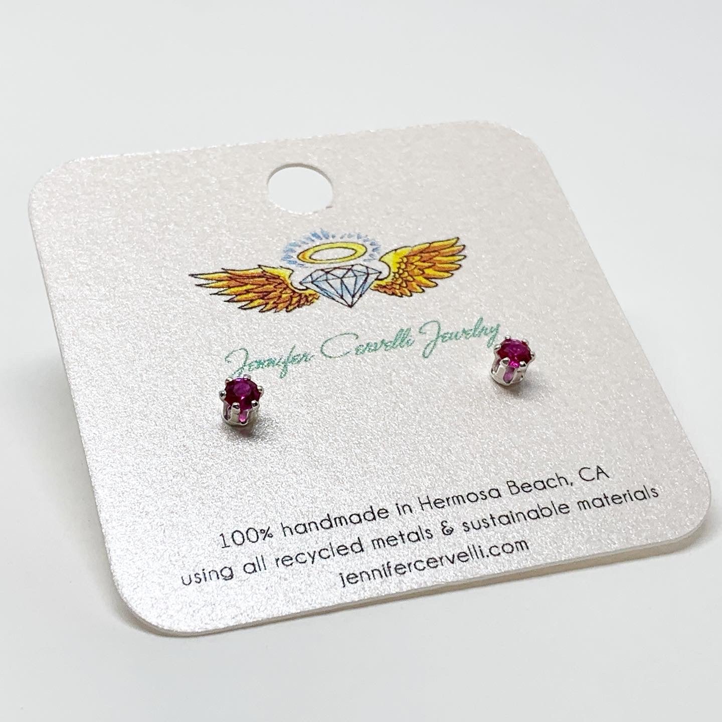 A pair of stunning ruby birthstone earrings featuring 3mm round faceted rubies set in 6 prong stud design, available in sterling silver or yellow gold fill.