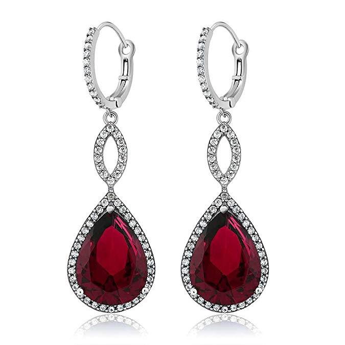 Elegant Ruby Pave Teardrop Infinity Drop earrings embellished with certified crystals, crafted in 18K white gold, showcasing a luxurious design.