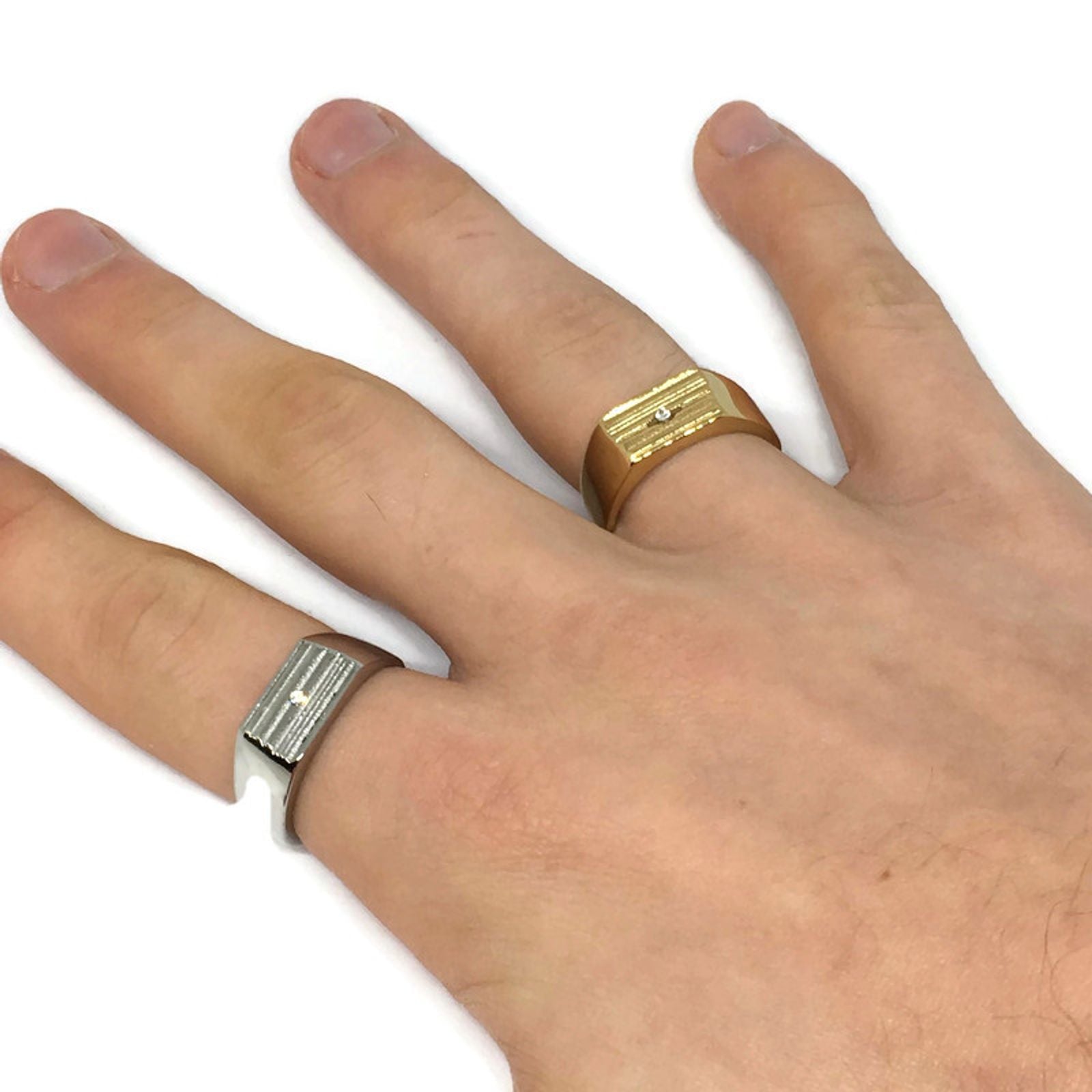 Rugged Iced Band Ring made of stainless steel with AAA cubic zirconia, showcasing its elegant design and multiple color options.