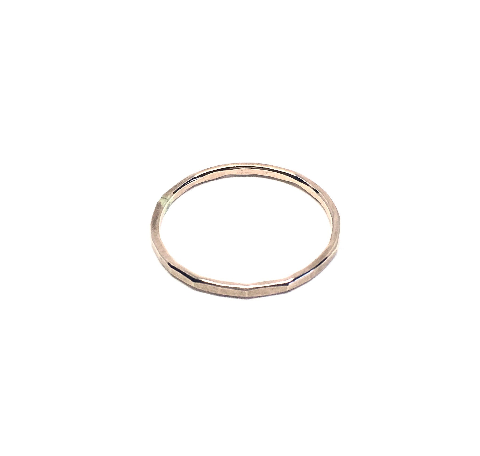 A set of Rustic Stacking Rings featuring a textured hammered finish, made from recycled metals in gold, rose gold, and silver.