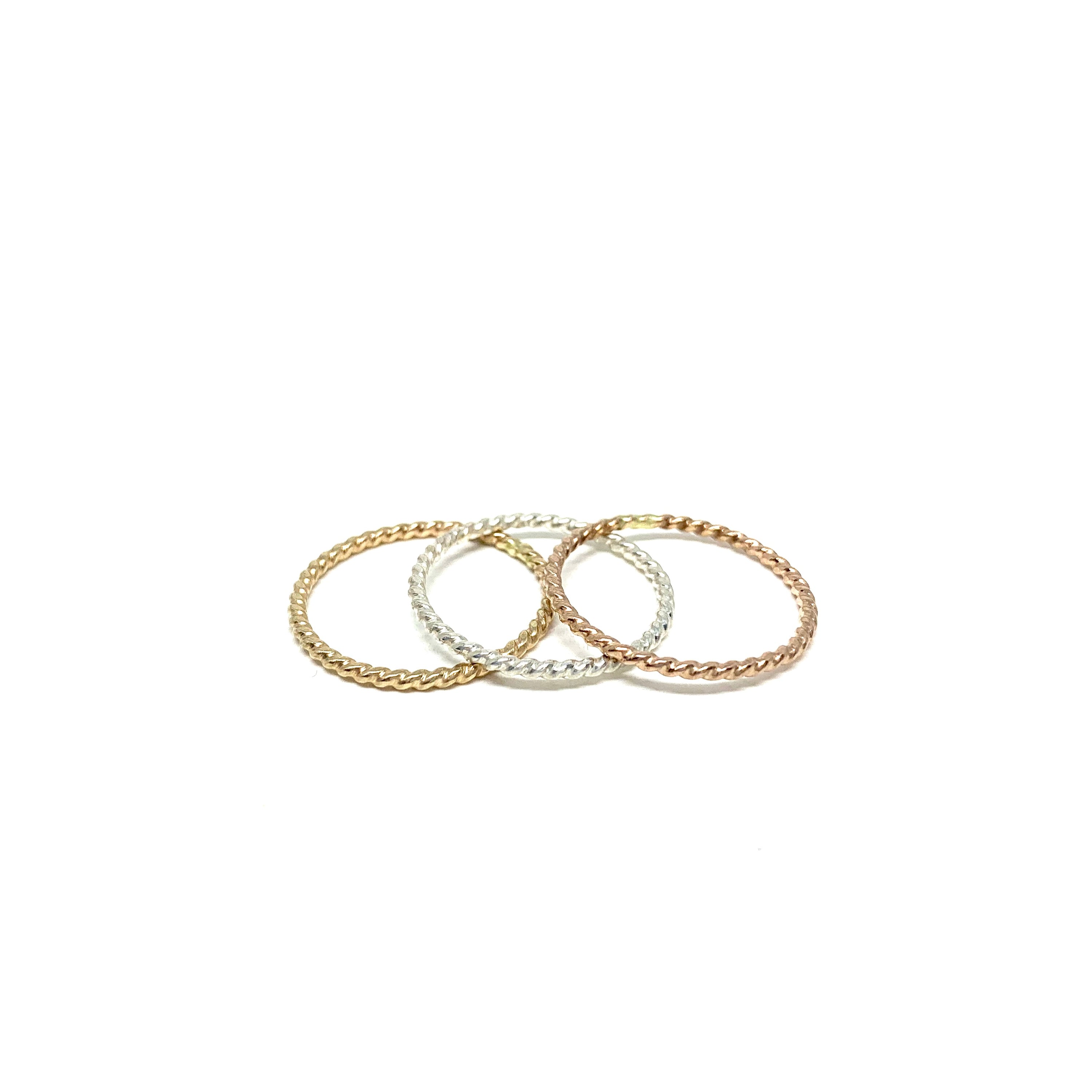 Rustic Twist Stacking Ring made from recycled metal with a delicate twisted texture, showcasing its unique design and craftsmanship.