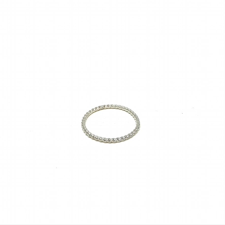 Rustic Twist Stacking Ring made from recycled metal with a delicate twisted texture, showcasing its unique design and craftsmanship.