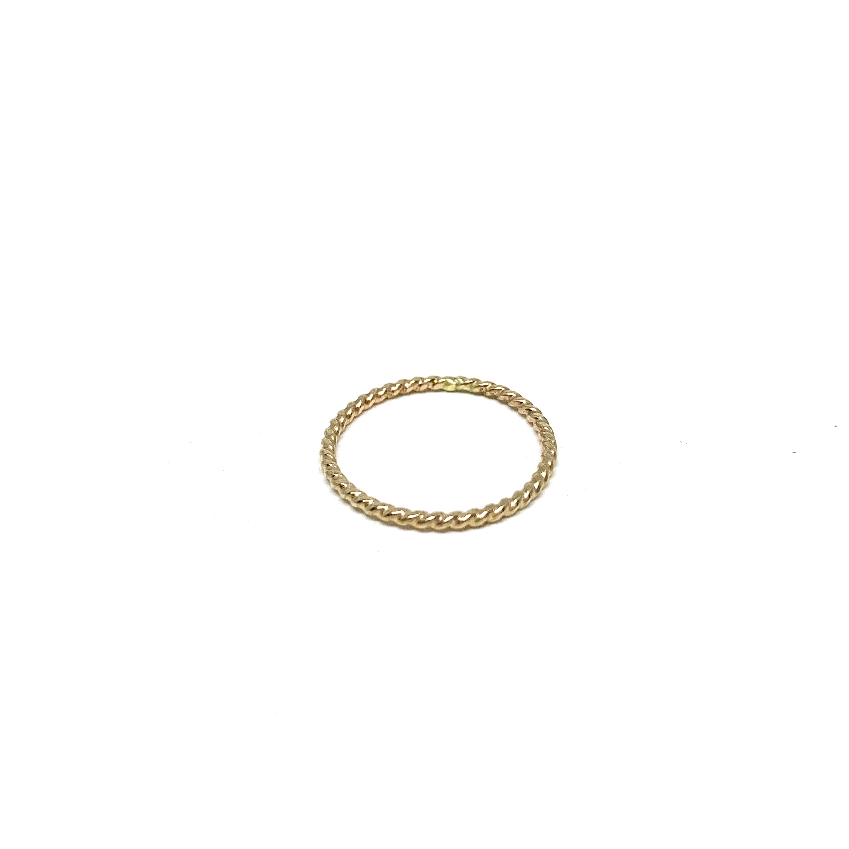 Rustic Twist Stacking Ring made from recycled metal with a delicate twisted texture, showcasing its unique design and craftsmanship.