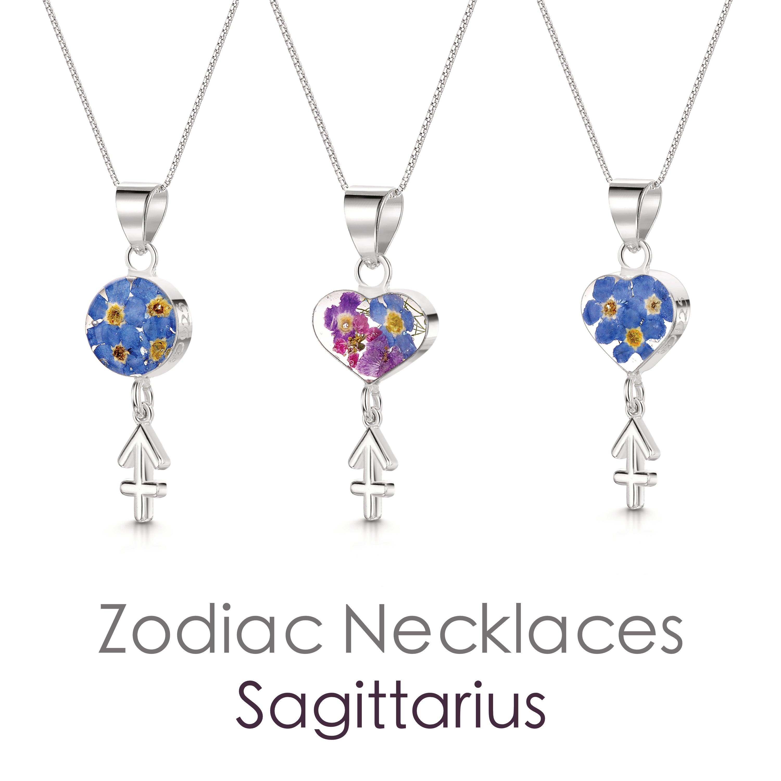 Sagittarius Necklace featuring a sterling silver pendant with real flowers and a detailed zodiac charm, showcasing elegance and individuality.