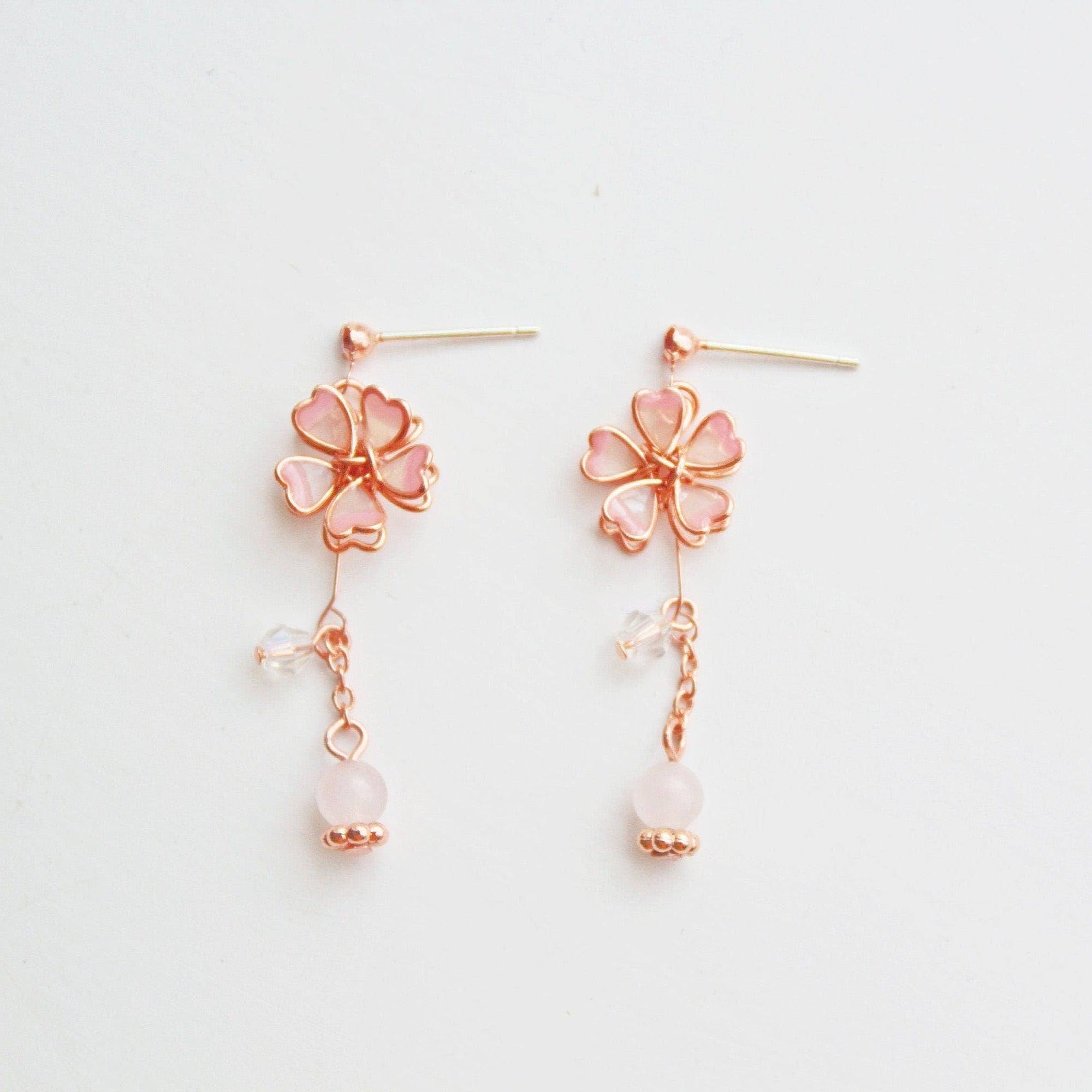 Sakura Flower Earrings featuring pink cherry blossoms and crystal drops, handmade with rose gold wire and sterling silver studs.