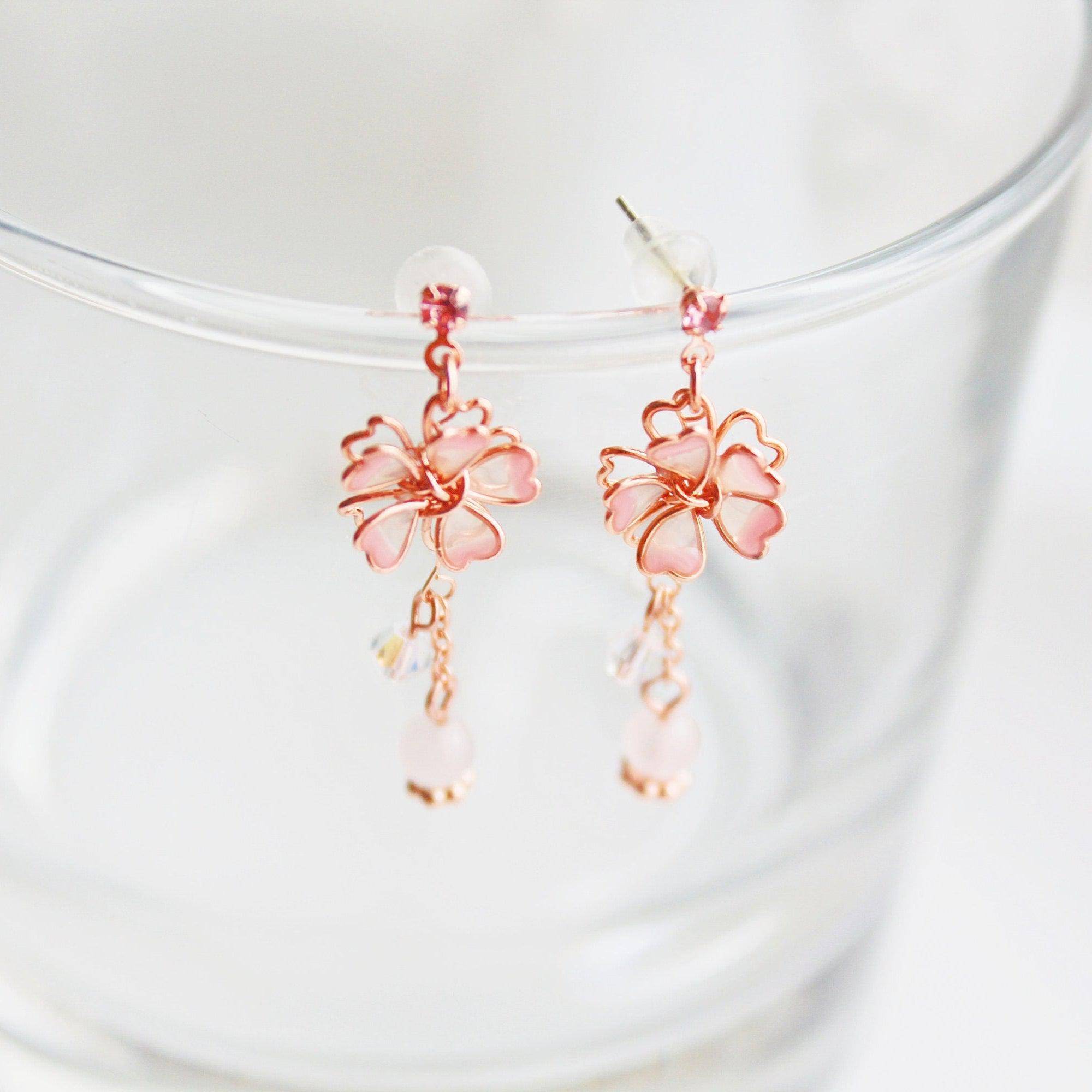 Sakura Flower Earrings featuring pink cherry blossoms and crystal drops, handmade with rose gold wire and sterling silver studs.