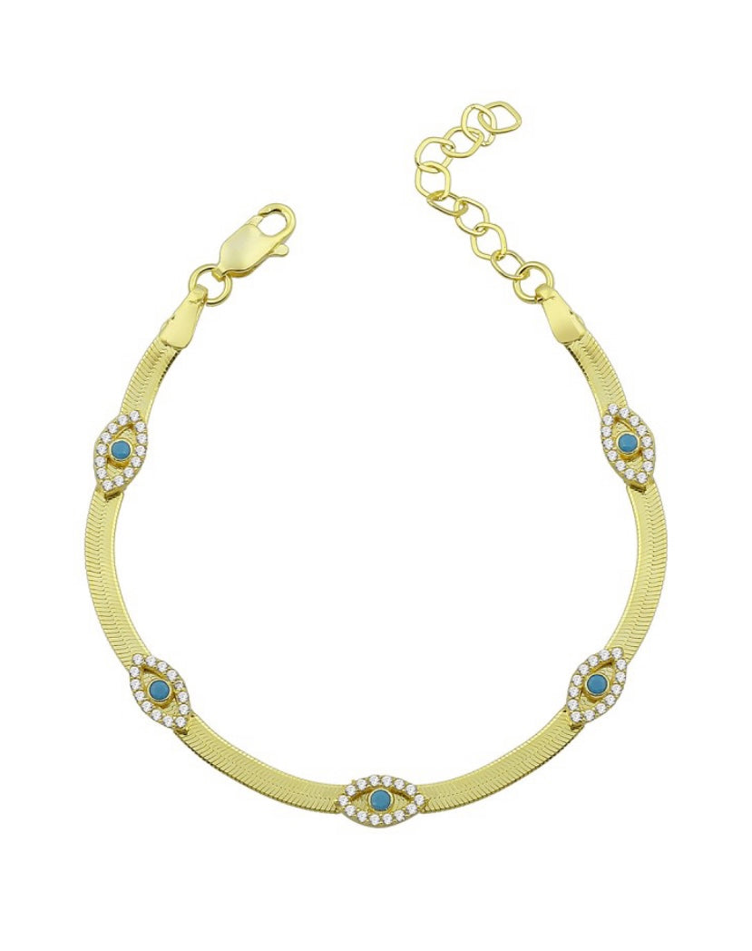 SAMIRA Bracelet featuring herringbone design with evil eye charms, cubic zirconias, and turquoise accents, set in yellow gold plated 925 sterling silver.