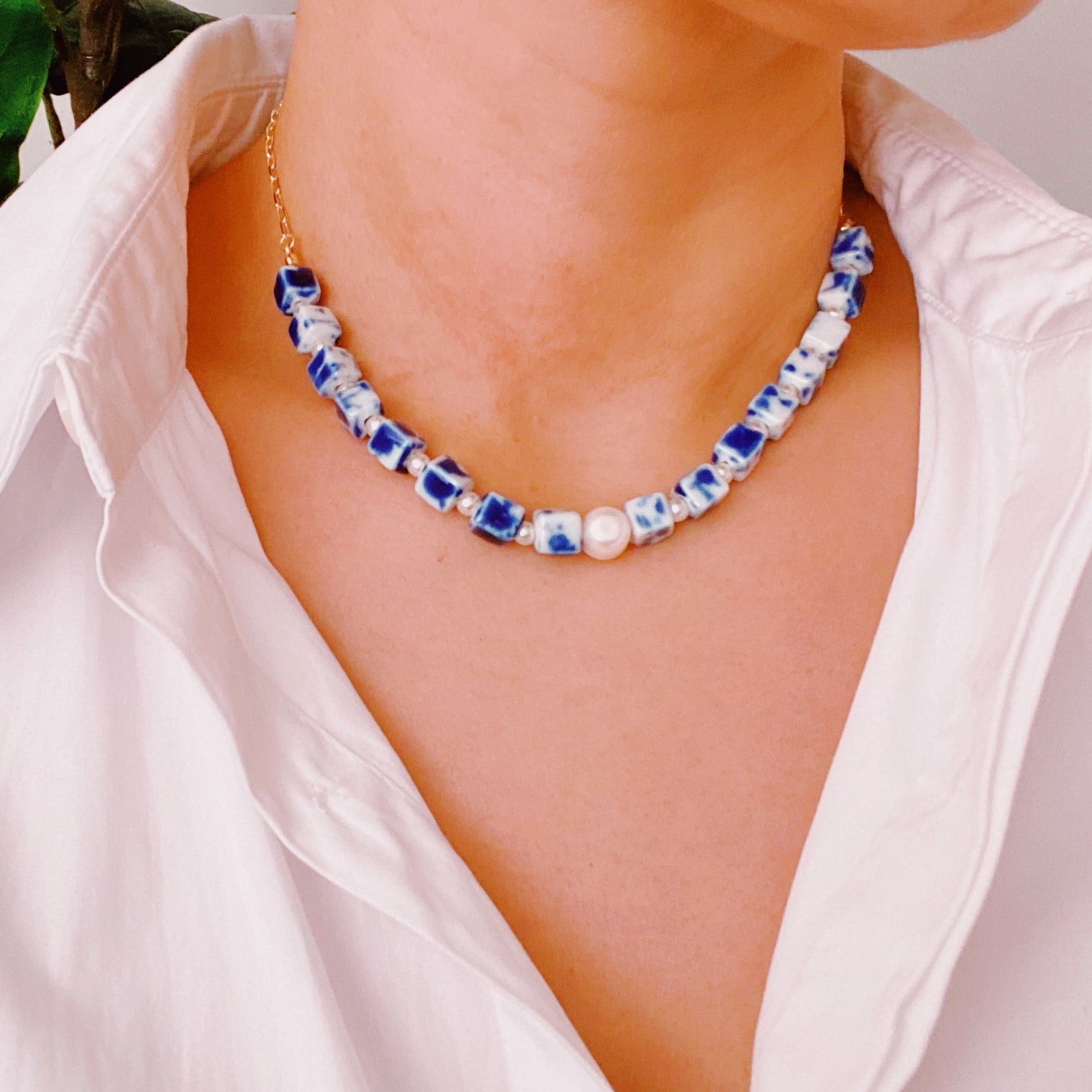 Santorini Touch Freshwater Pearl Necklace featuring a central pearl and colorful ceramic beads, elegantly designed with a gold-plated alloy chain.