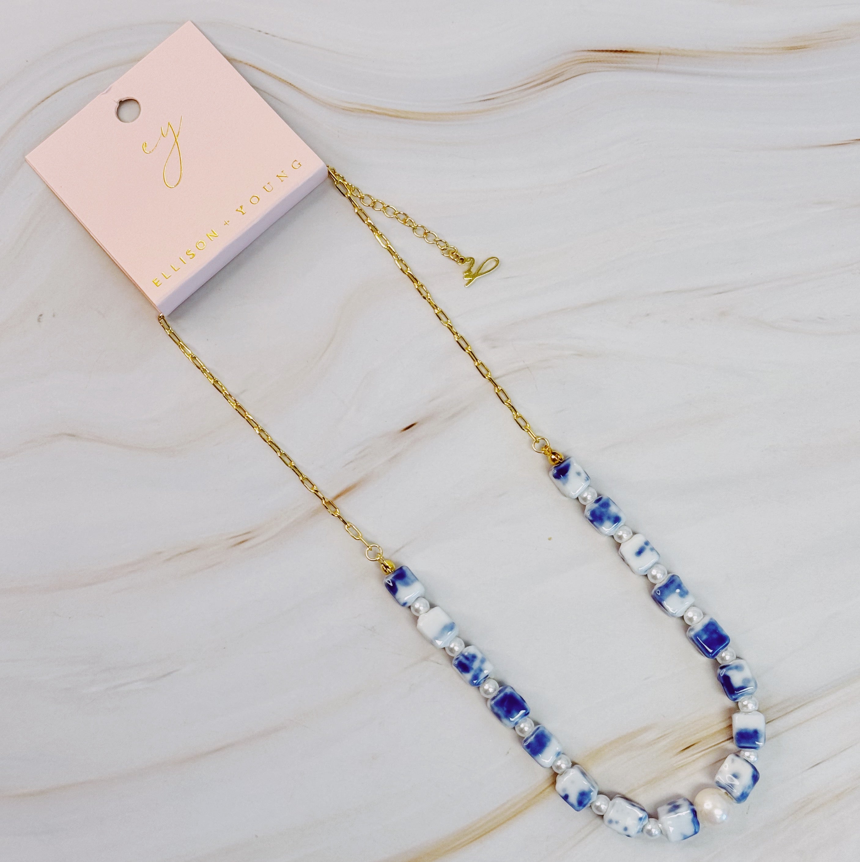 Santorini Touch Freshwater Pearl Necklace featuring a central pearl and colorful ceramic beads, elegantly designed with a gold-plated alloy chain.