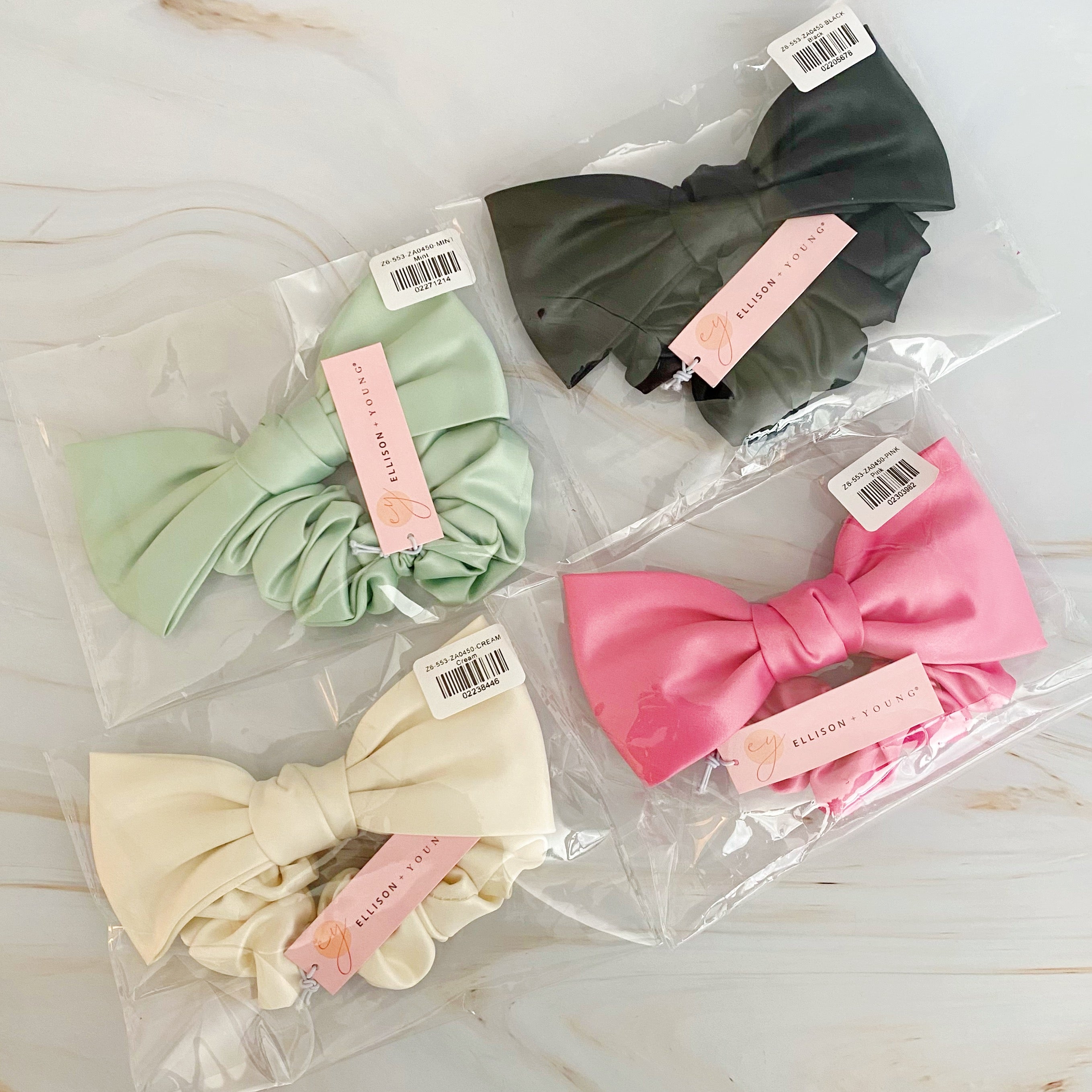 A stylish satin bow tie hair scrunchie in elegant colors, perfect for adding sophistication to any hairstyle.