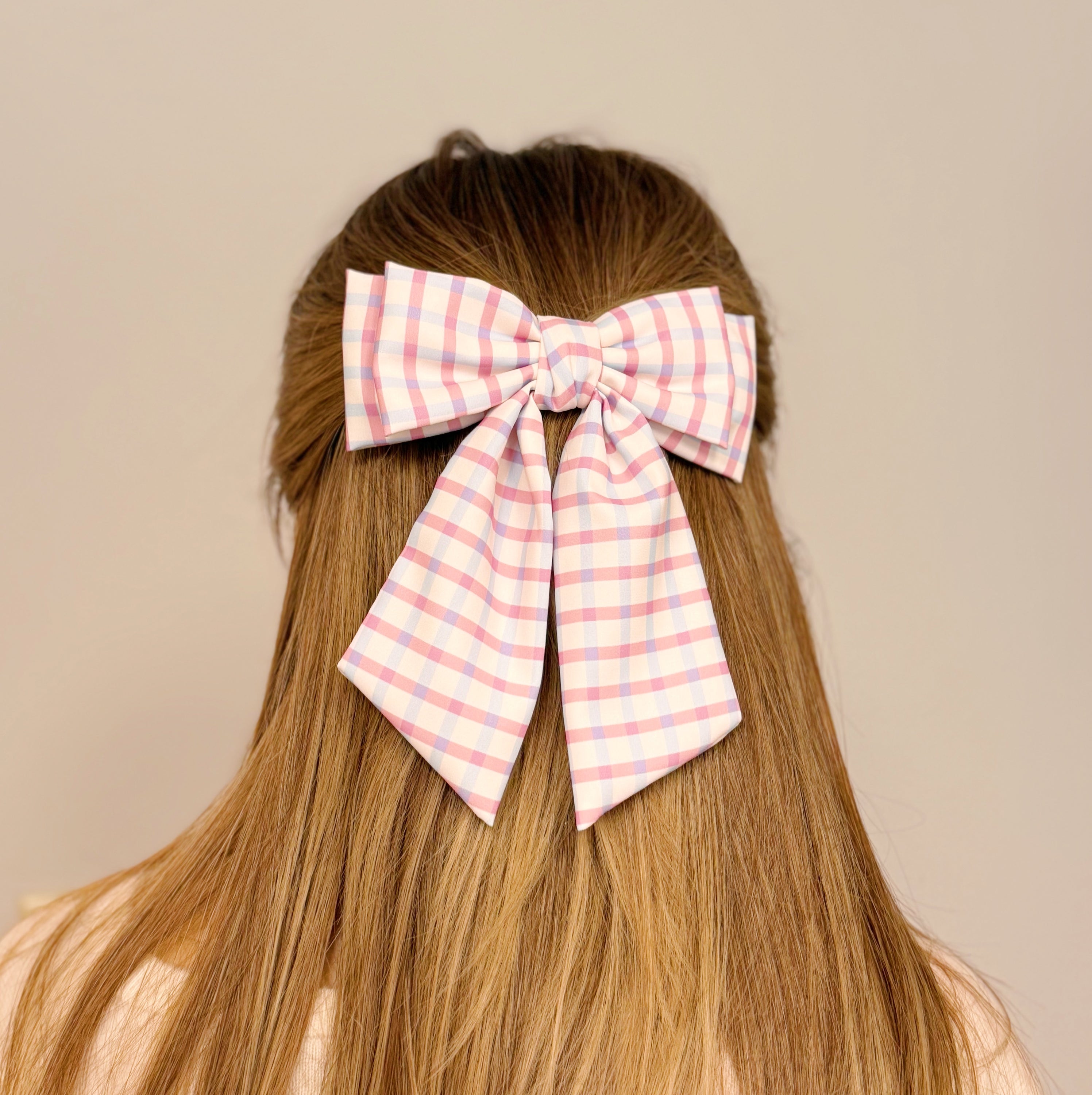 Satin Precious Double Bow Hair Clip featuring a unique double bow design in elegant fabric, perfect for stylish hairstyles.