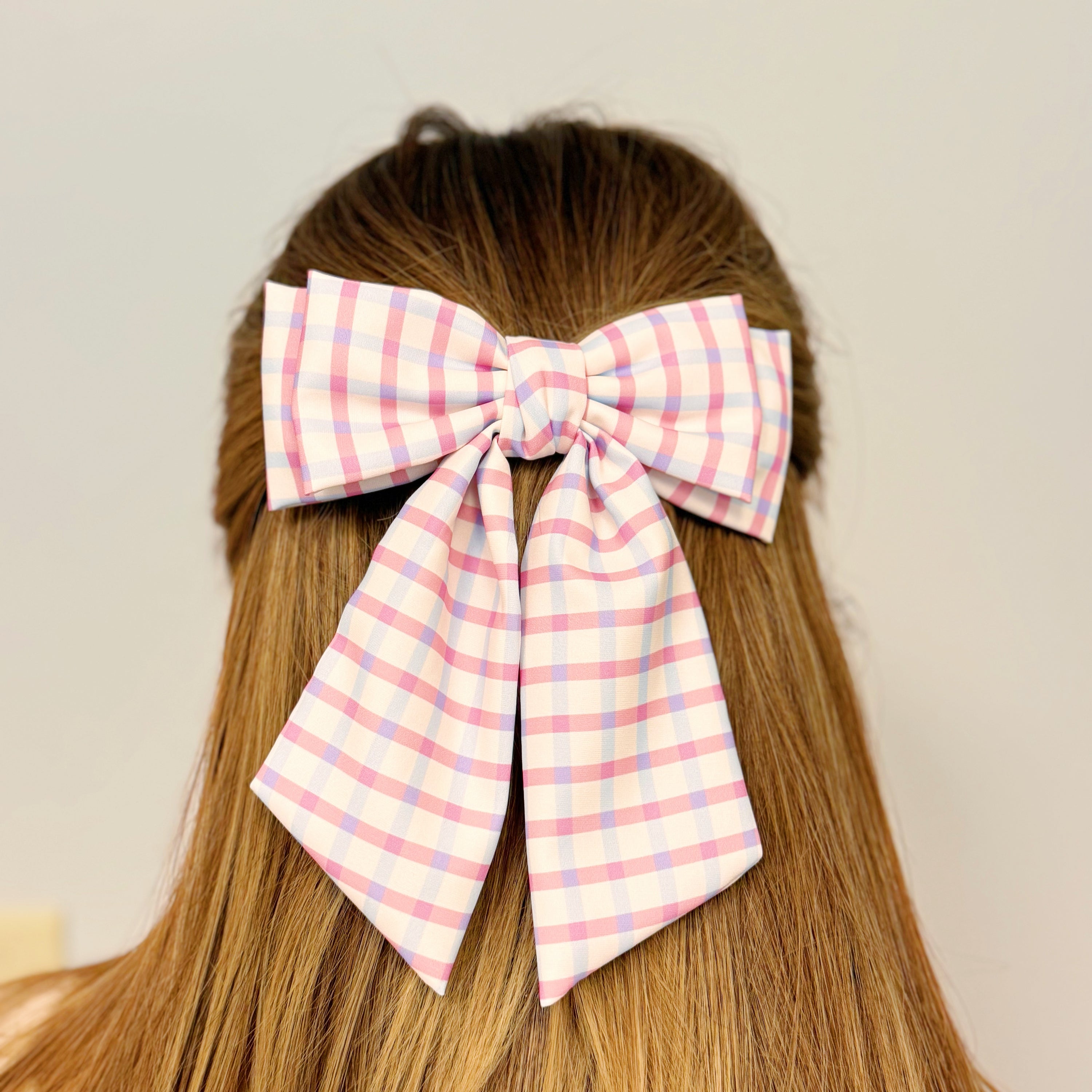 Satin Precious Double Bow Hair Clip featuring a unique double bow design in elegant fabric, perfect for stylish hairstyles.