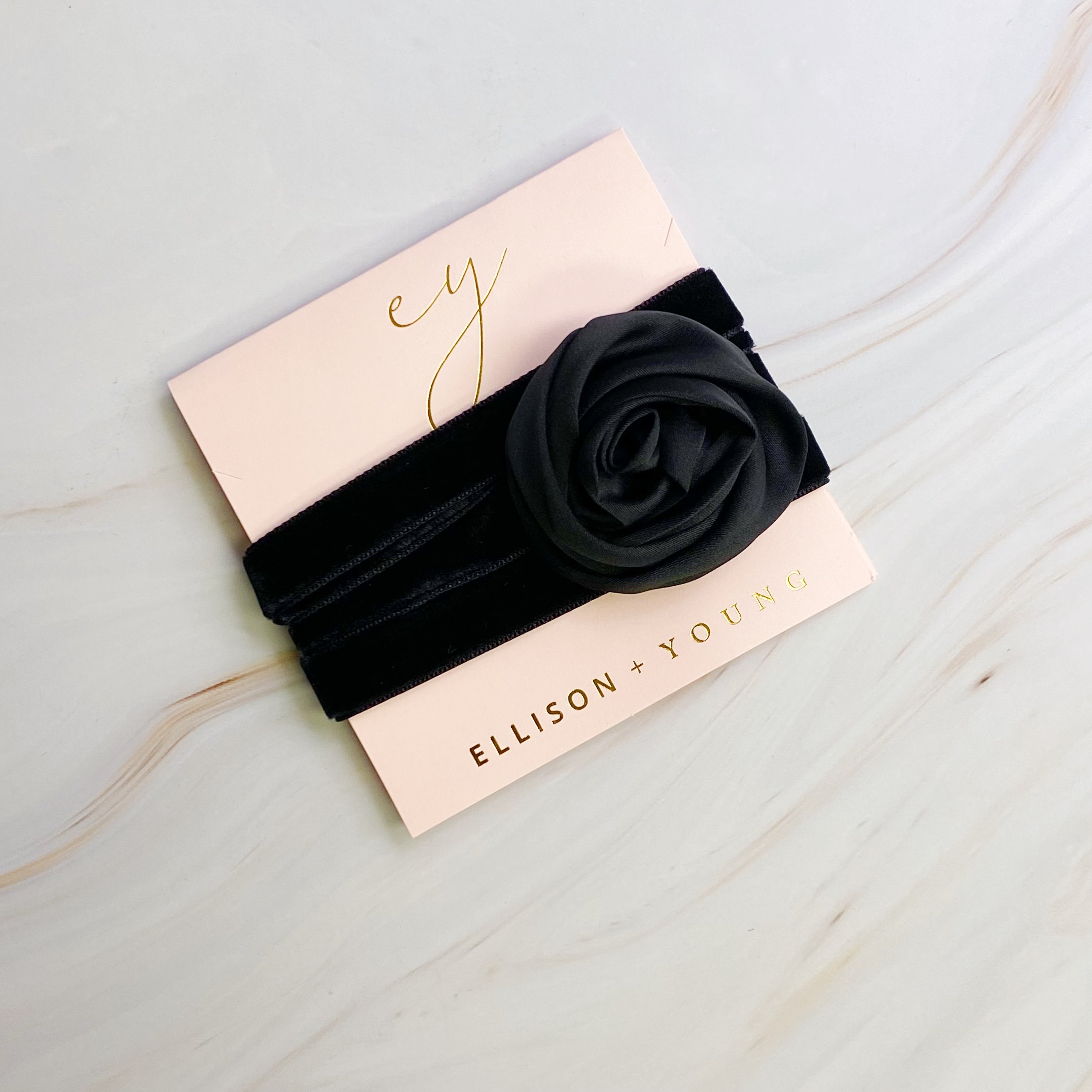 A beautifully crafted Satin Rose Velvet Sash Necklace with a soft velvet tie, showcasing its versatility as a choker, bracelet, or hair accessory.