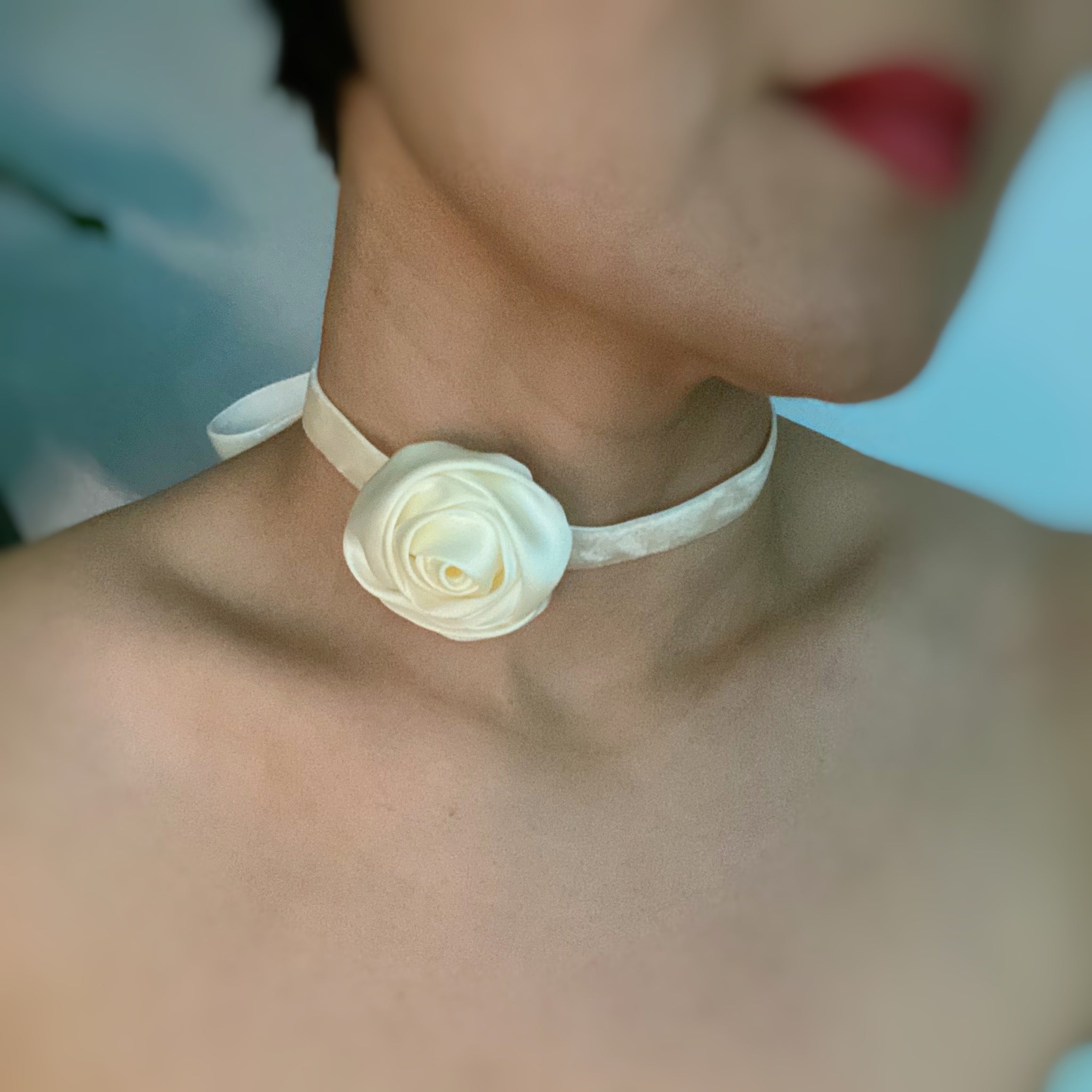 A beautifully crafted Satin Rose Velvet Sash Necklace with a soft velvet tie, showcasing its versatility as a choker, bracelet, or hair accessory.