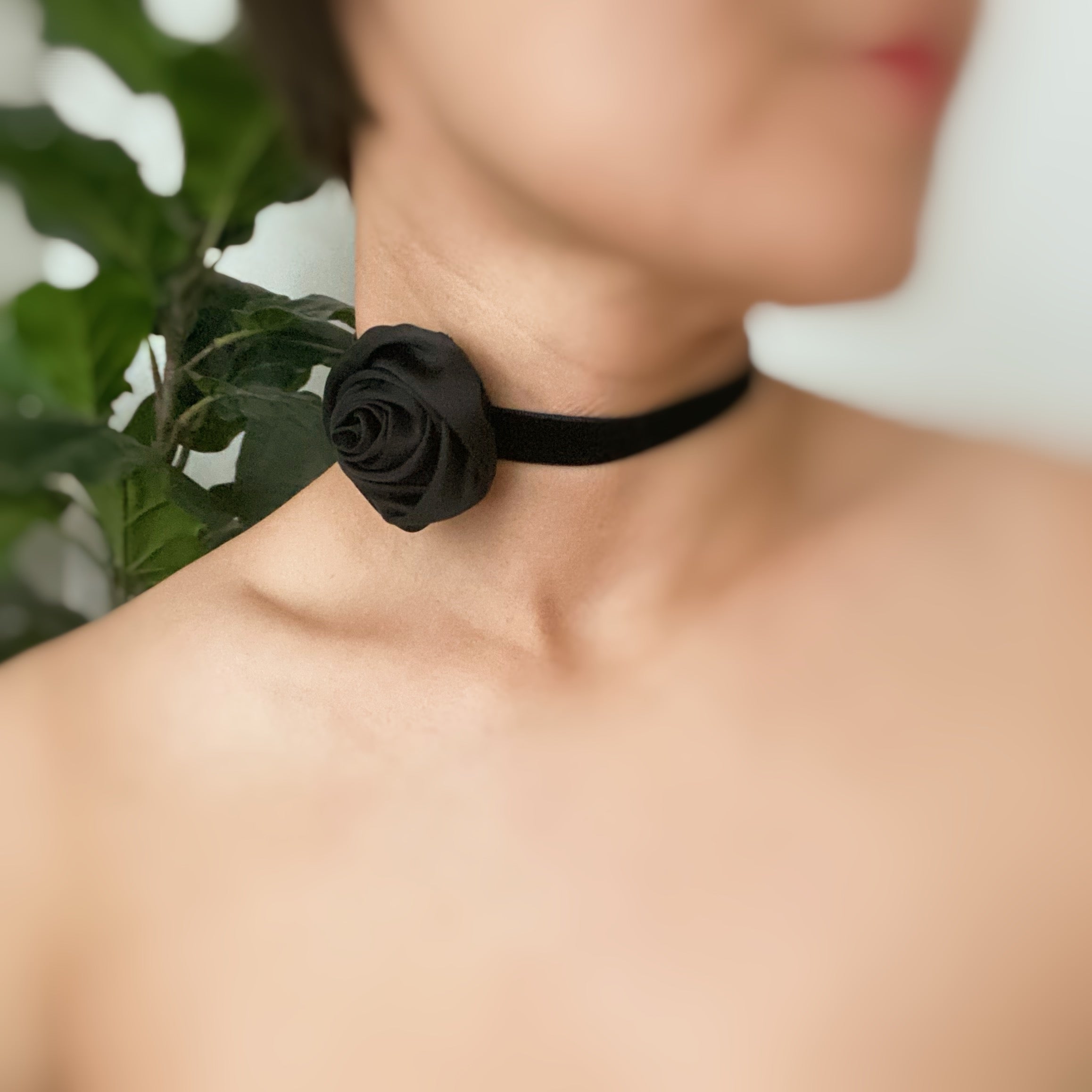 A beautifully crafted Satin Rose Velvet Sash Necklace with a soft velvet tie, showcasing its versatility as a choker, bracelet, or hair accessory.