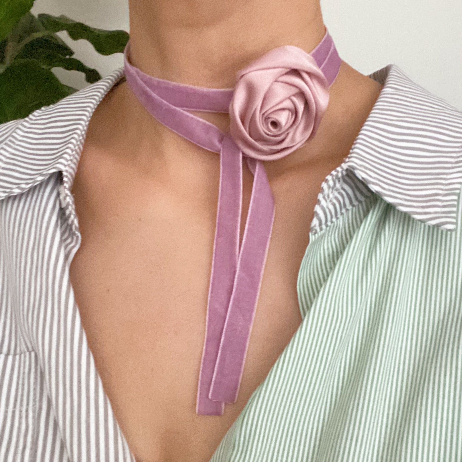 A beautifully crafted Satin Rose Velvet Sash Necklace with a soft velvet tie, showcasing its versatility as a choker, bracelet, or hair accessory.