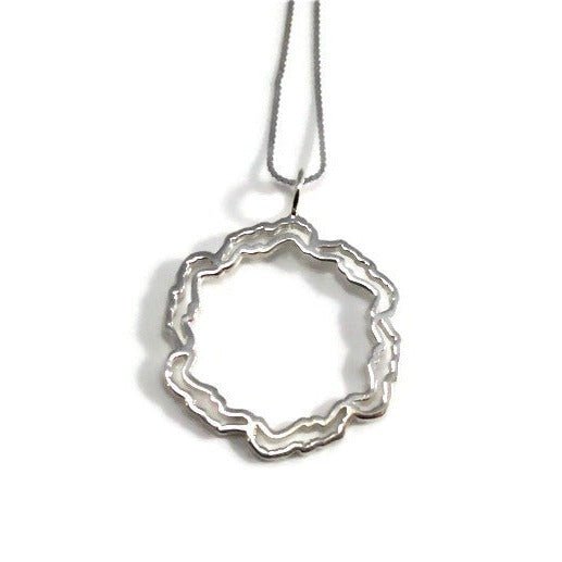 Elegant Savary Circle Necklace in 925 sterling silver with options for gold plating, displayed on a soft background.