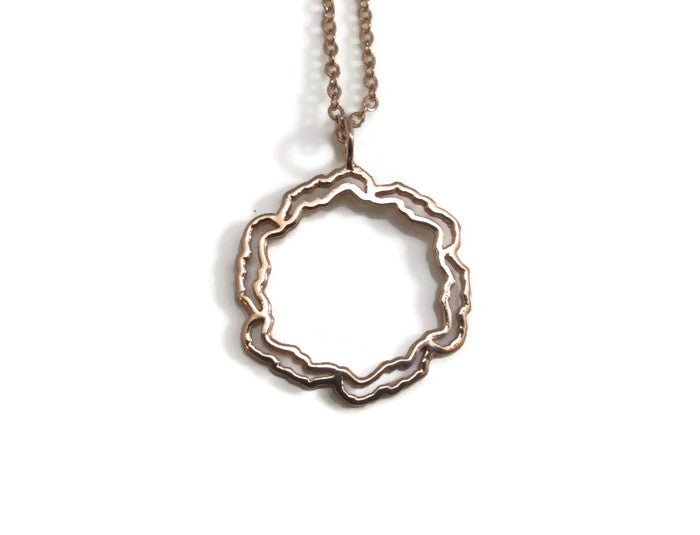 Elegant Savary Circle Necklace in 925 sterling silver with options for gold plating, displayed on a soft background.