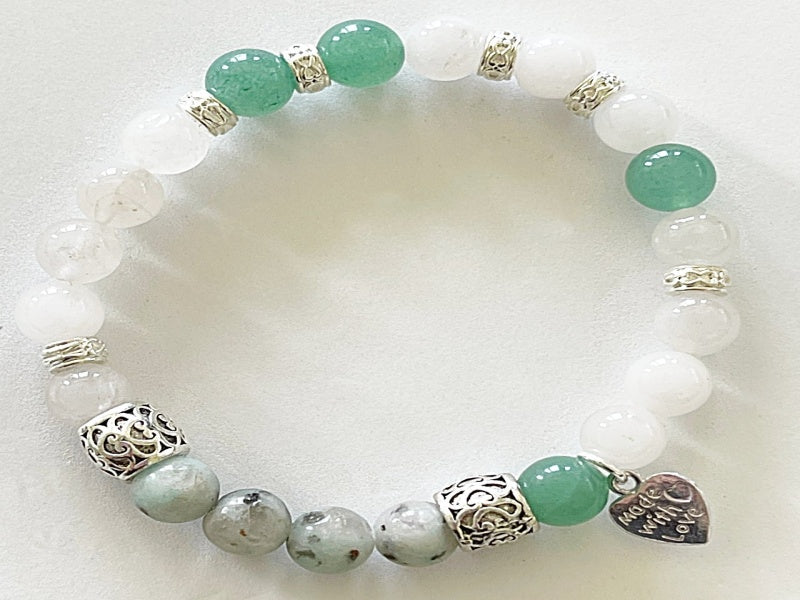 A stylish stretch bracelet featuring Morse Code spelling 'Breathe!' with green Aventurine, sesame jasper, and blue lapis lazuli gemstones.