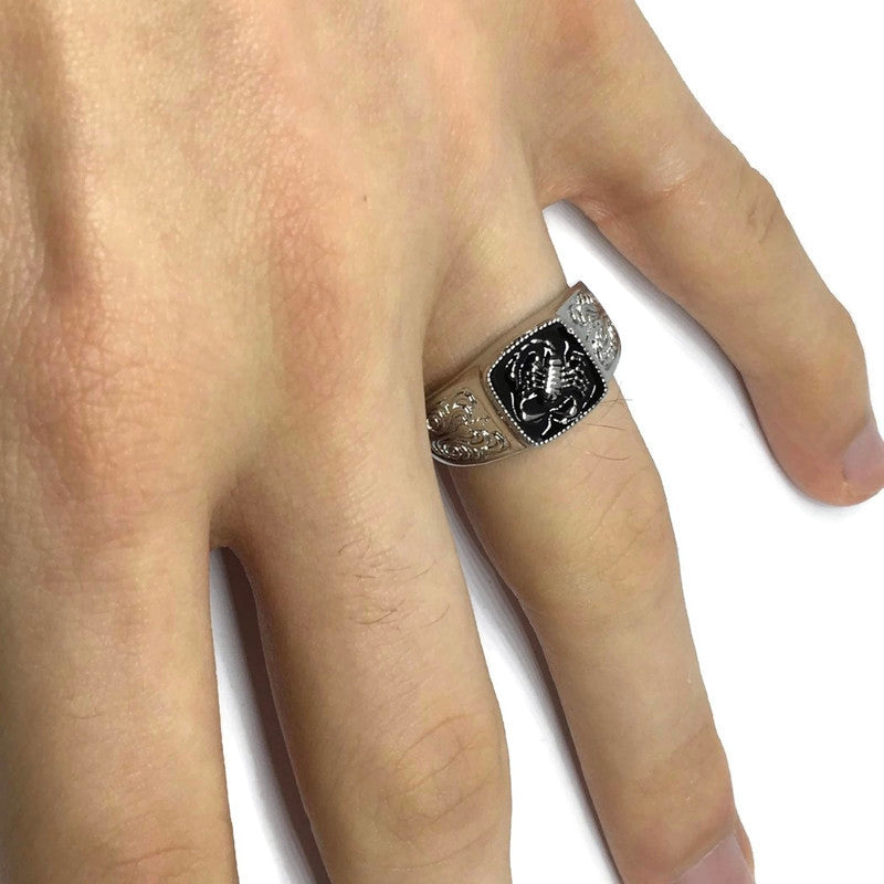 A stylish Scorpion Paisley Band Ring made of sterling silver plated steel alloy, featuring an intricate paisley design suitable for unisex wear.