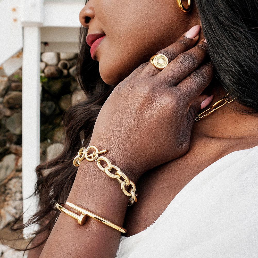 Screw Nail Wire Link Set featuring a gold and rose gold bangle and bracelet with cubic zirconia accents, elegantly displayed in a gift box.