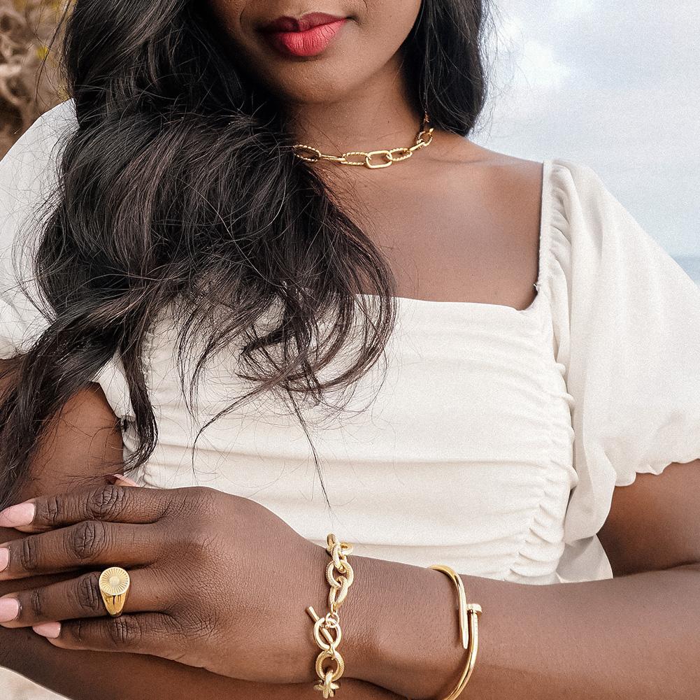 Screw Nail Wire Link Set featuring a gold and rose gold bangle and bracelet with cubic zirconia accents, elegantly displayed in a gift box.