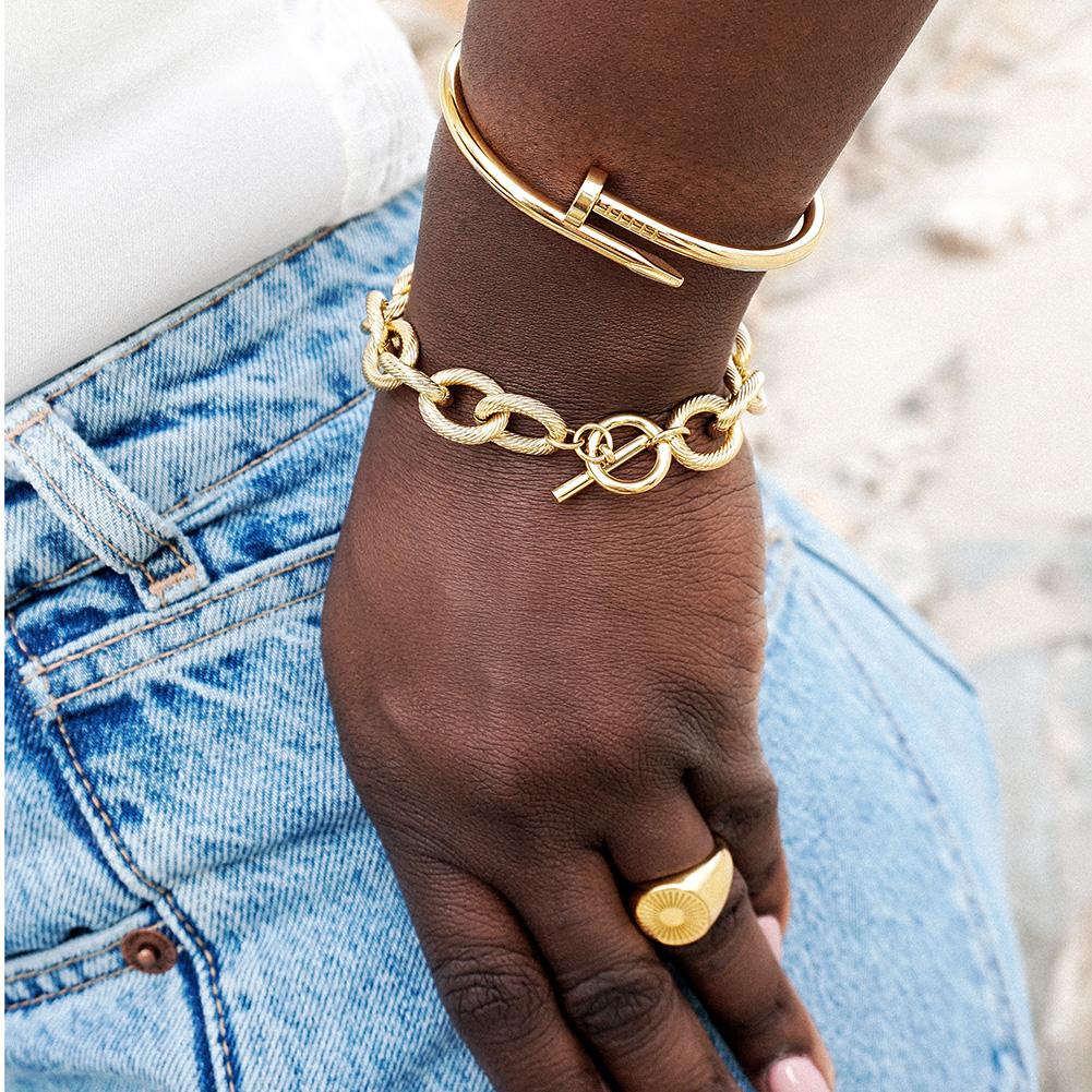 Screw Nail Wire Link Set featuring a gold and rose gold bangle and bracelet with cubic zirconia accents, elegantly displayed in a gift box.