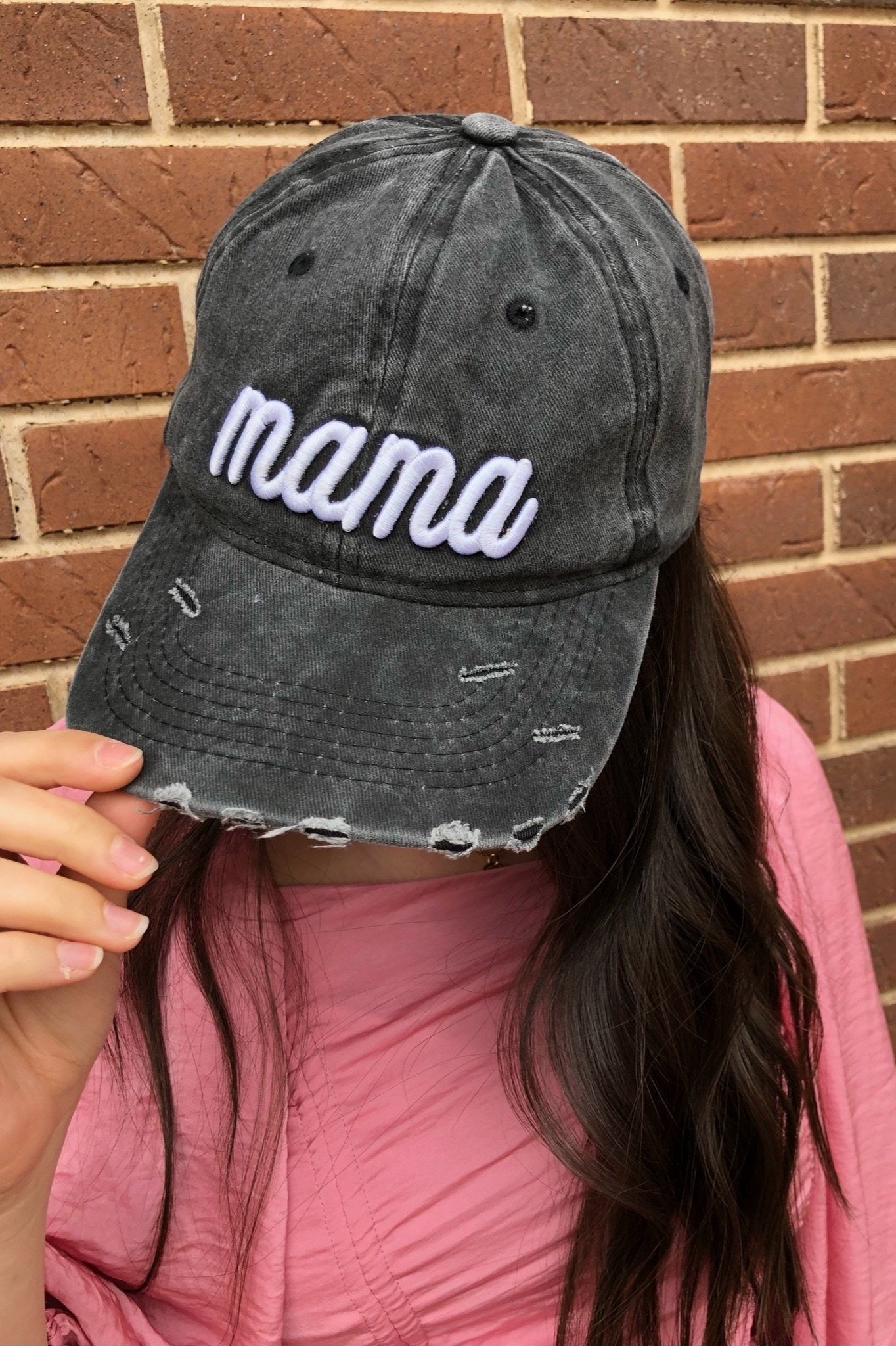 Dark gray distressed baseball cap with white 'Mama' embroidery and adjustable strap.