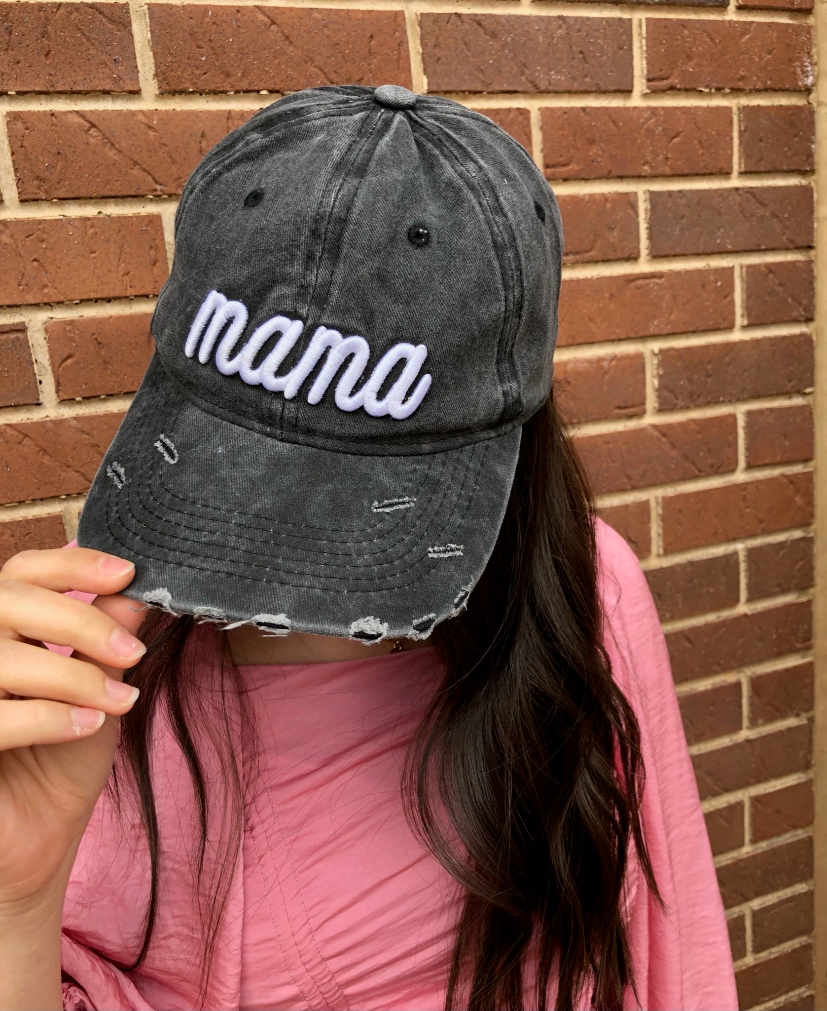 Dark gray distressed baseball cap with white 'Mama' embroidery and adjustable strap.