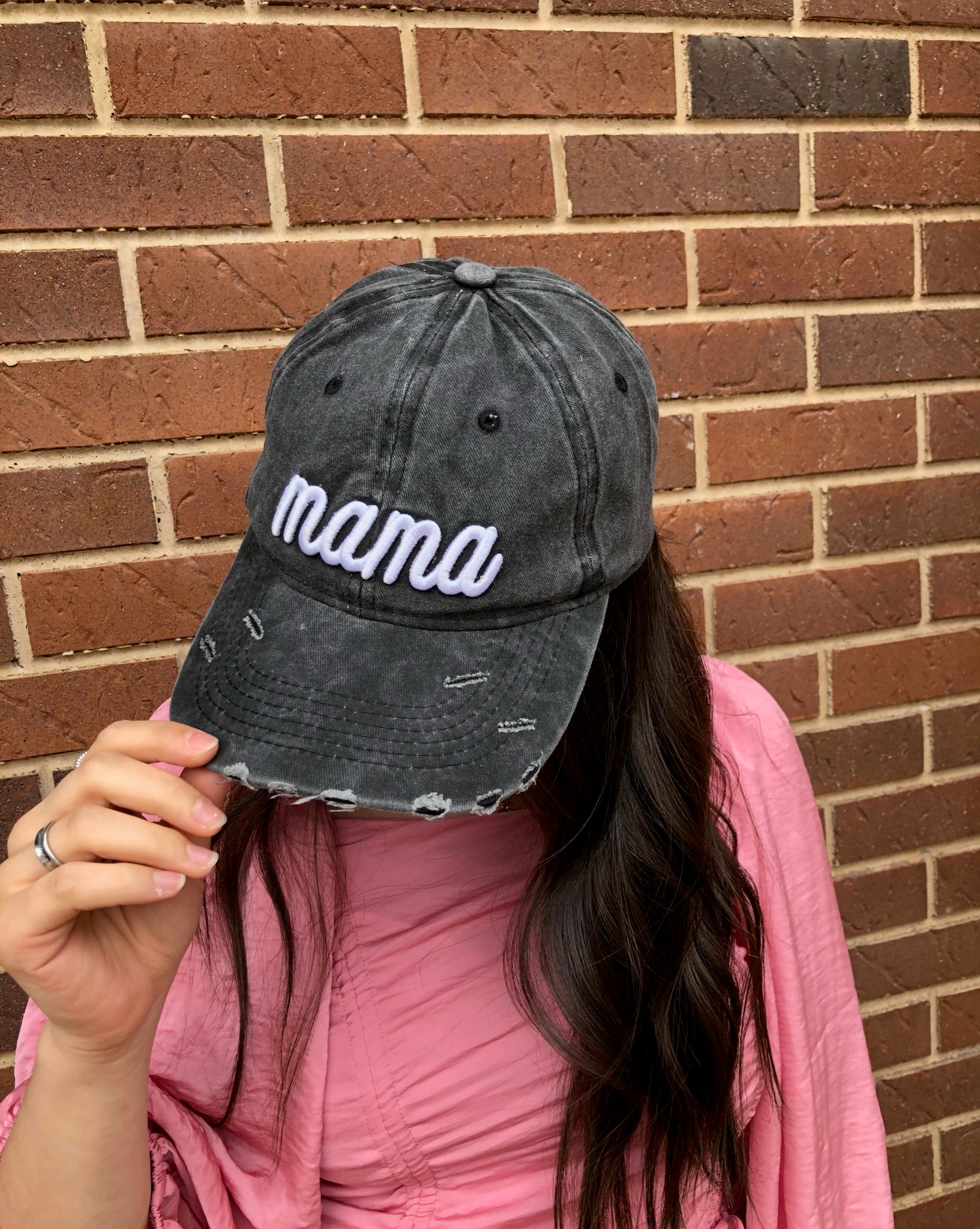 Dark gray distressed baseball cap with white 'Mama' embroidery and adjustable strap.