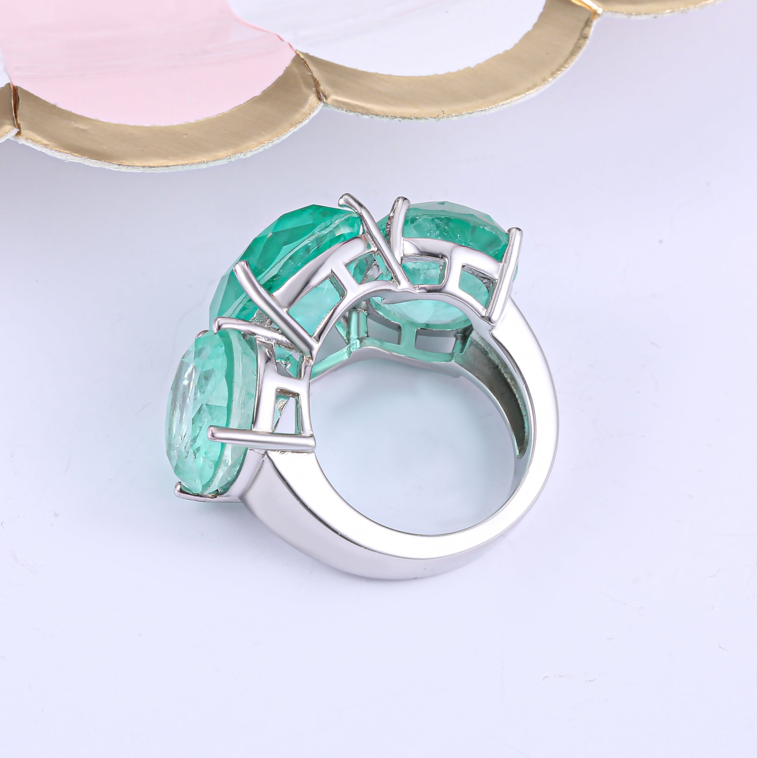 A beautiful See Blue Paraiba Fantastic Ring made of 925 sterling silver with real white gold, featuring three oval Paraiba stones.