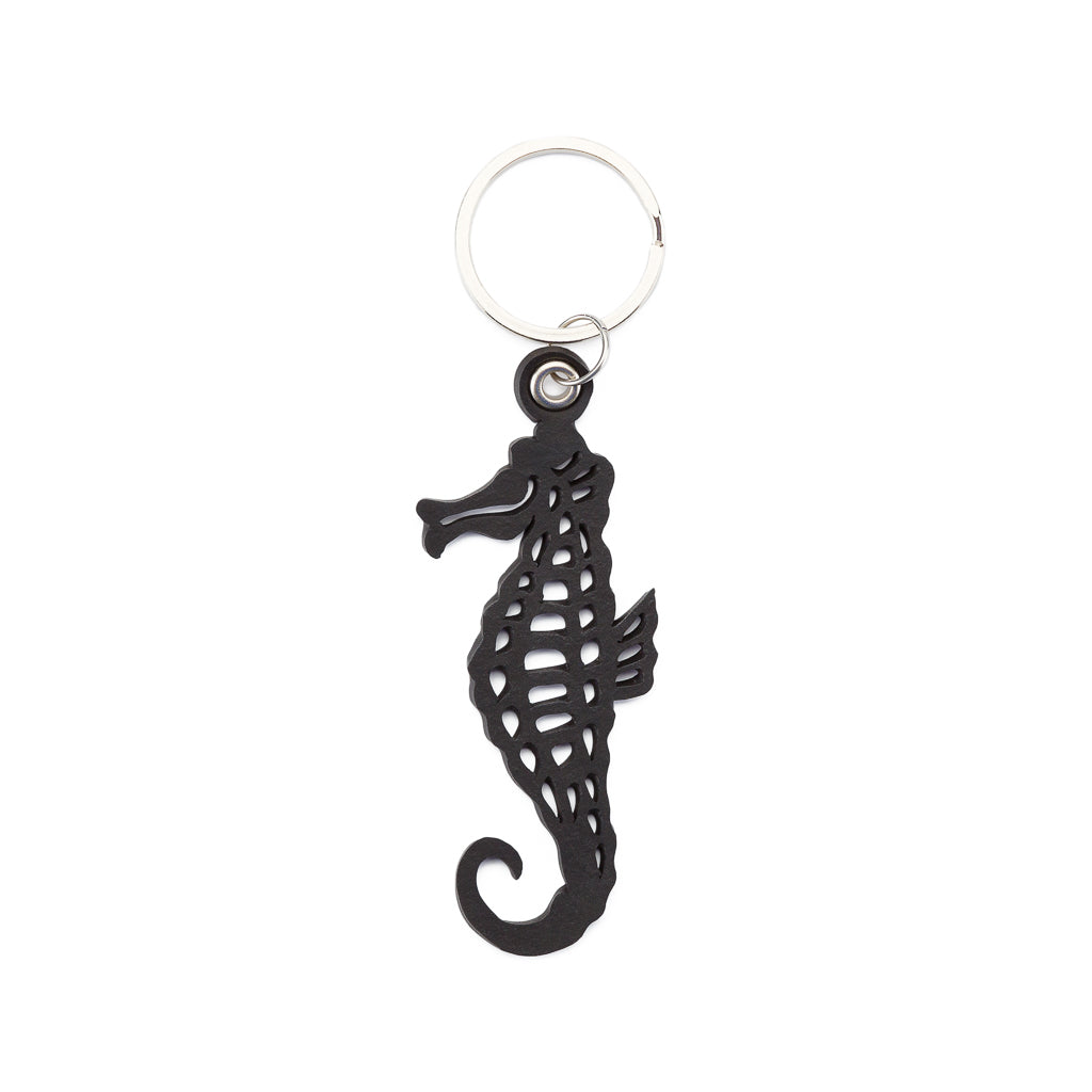 A handcrafted Seahorse Recycled Rubber Vegan Keyring showcasing unique thread markings and eco-friendly design.