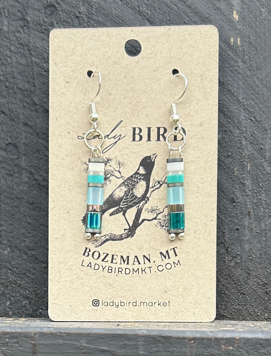 Seaside Mixed Blue & Silver Tila Bead Earrings featuring vibrant blue and silver beads, perfect for a bohemian style.