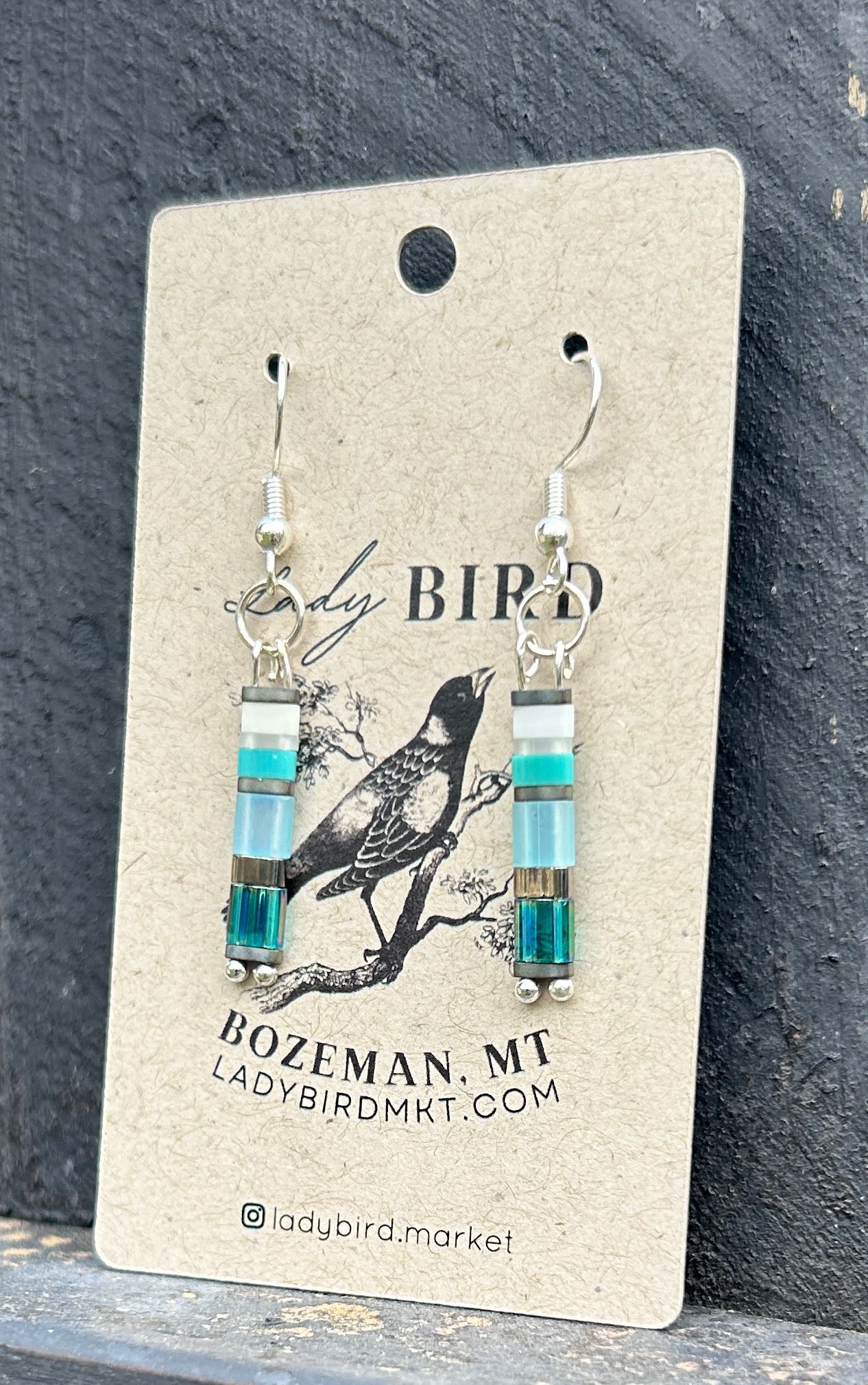 Seaside Mixed Blue & Silver Tila Bead Earrings featuring vibrant blue and silver beads, perfect for a bohemian style.