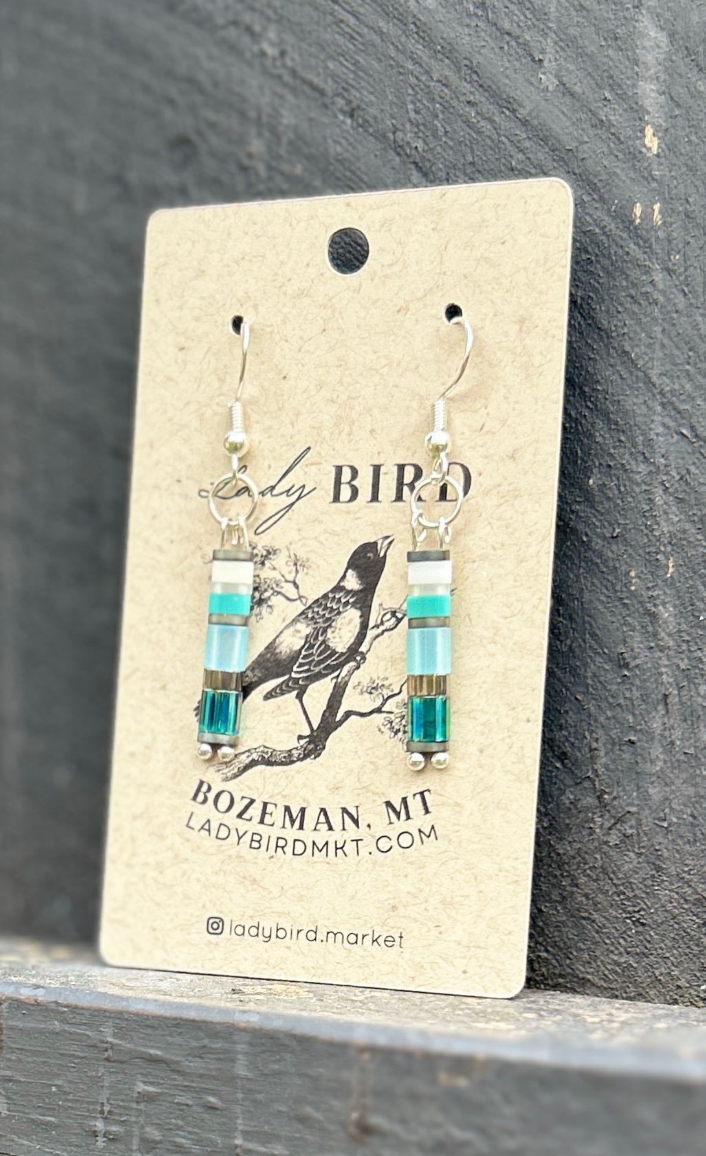 Seaside Mixed Blue & Silver Tila Bead Earrings featuring vibrant blue and silver beads, perfect for a bohemian style.