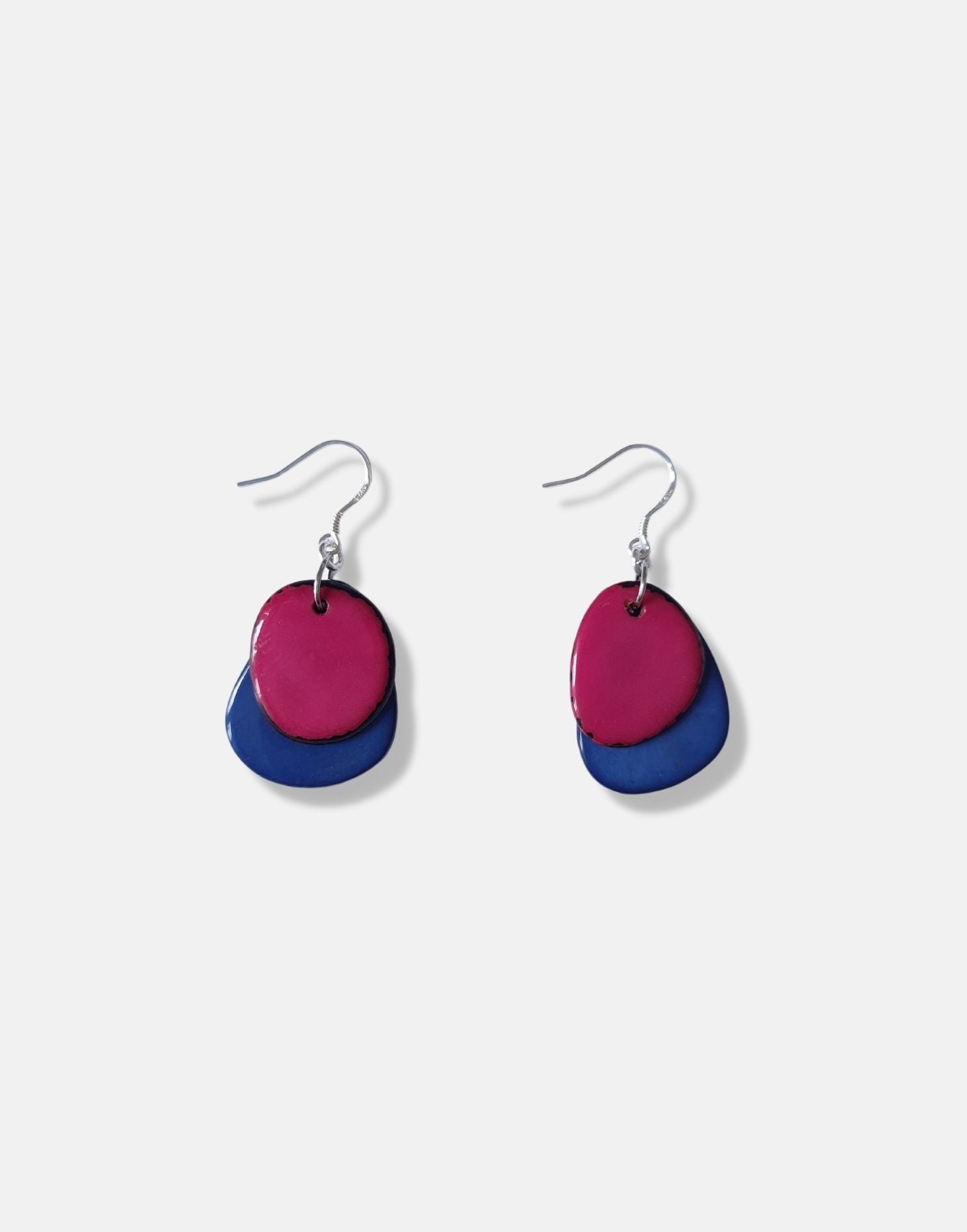 A pair of Secca Tagua Nut Earrings featuring organic vegetable ivory slices and sterling silver hooks, elegantly displayed in eco-friendly packaging.