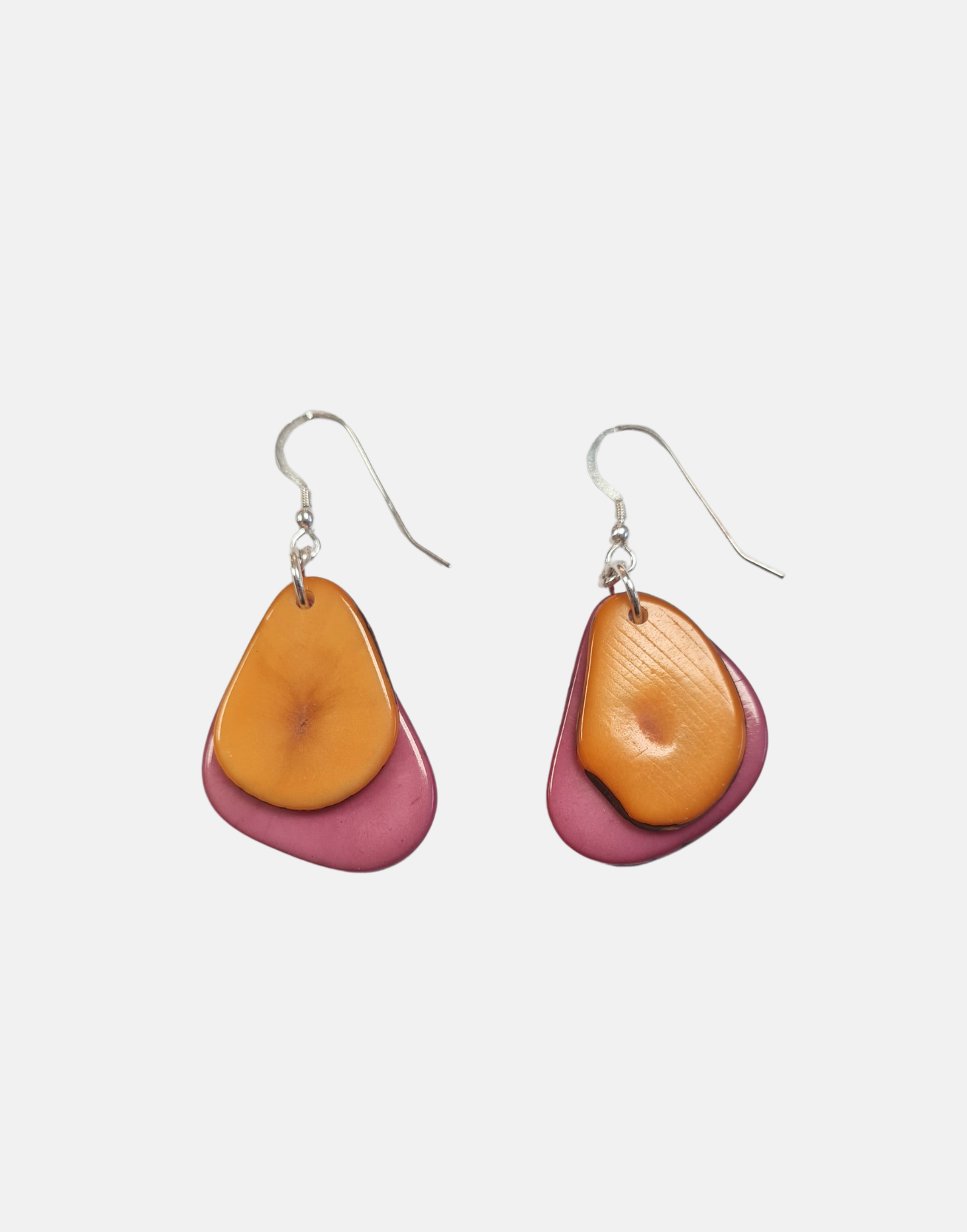 A pair of Secca Tagua Nut Earrings featuring organic vegetable ivory slices and sterling silver hooks, elegantly displayed in eco-friendly packaging.