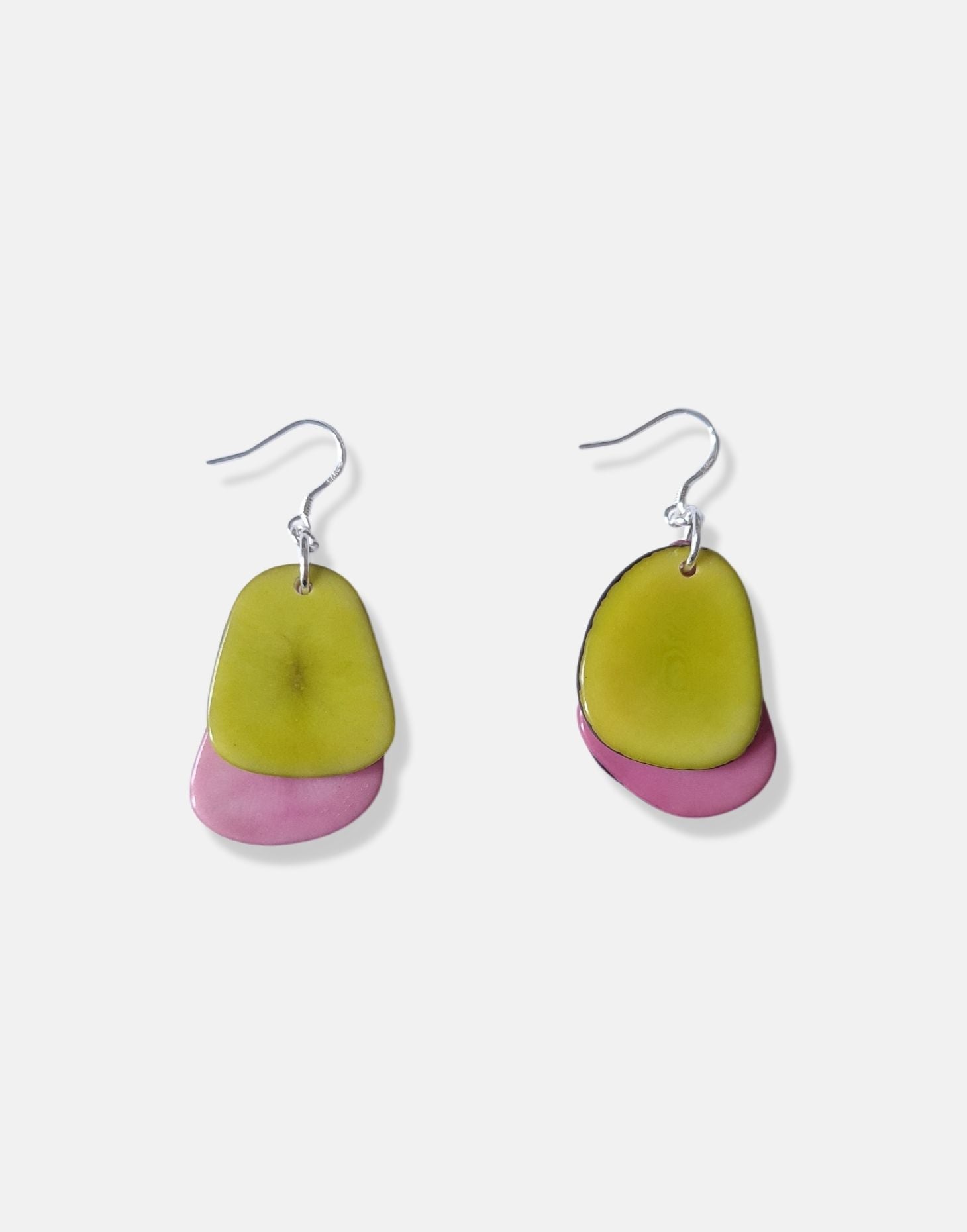 A pair of Secca Tagua Nut Earrings featuring organic vegetable ivory slices and sterling silver hooks, elegantly displayed in eco-friendly packaging.