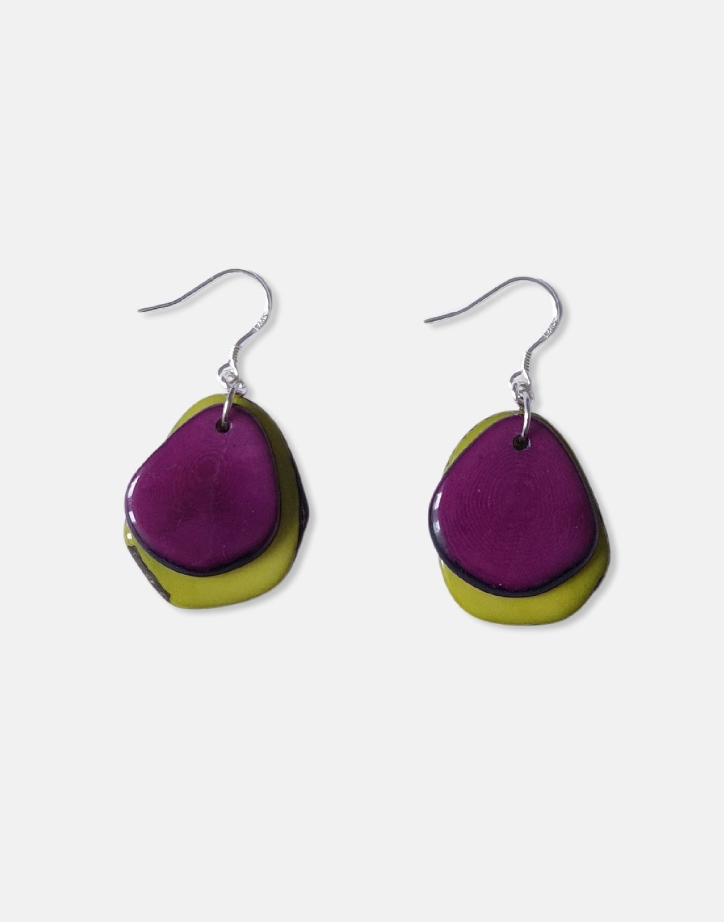 A pair of Secca Tagua Nut Earrings featuring organic vegetable ivory slices and sterling silver hooks, elegantly displayed in eco-friendly packaging.