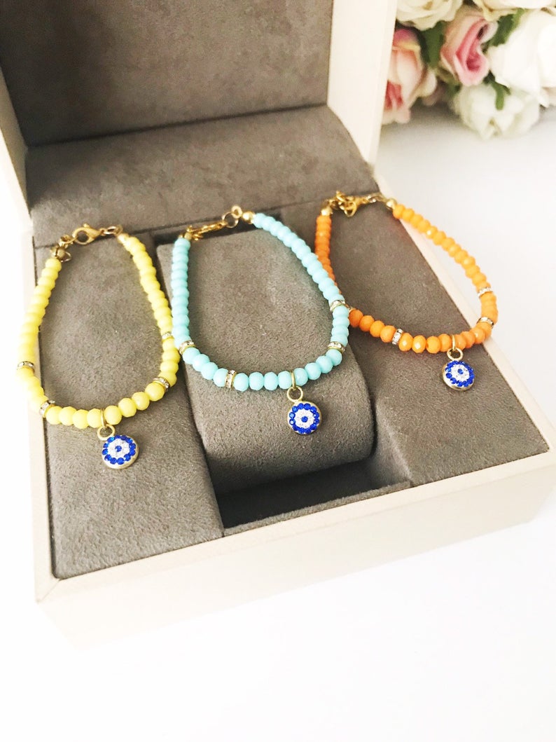 Handmade Evil Eye Bracelet featuring colorful Miyuki seed beads and an evil eye charm for protection.