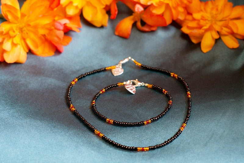 A colorful assortment of handcrafted seed bead necklaces displayed elegantly, showcasing various patterns and colors.