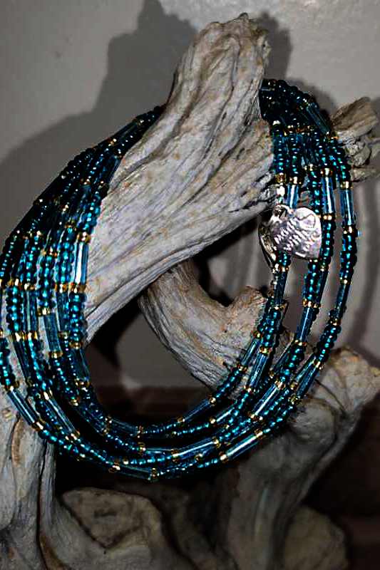 Colorful seed bead wraps displayed elegantly, showcasing their versatility for wrist or neck wear.