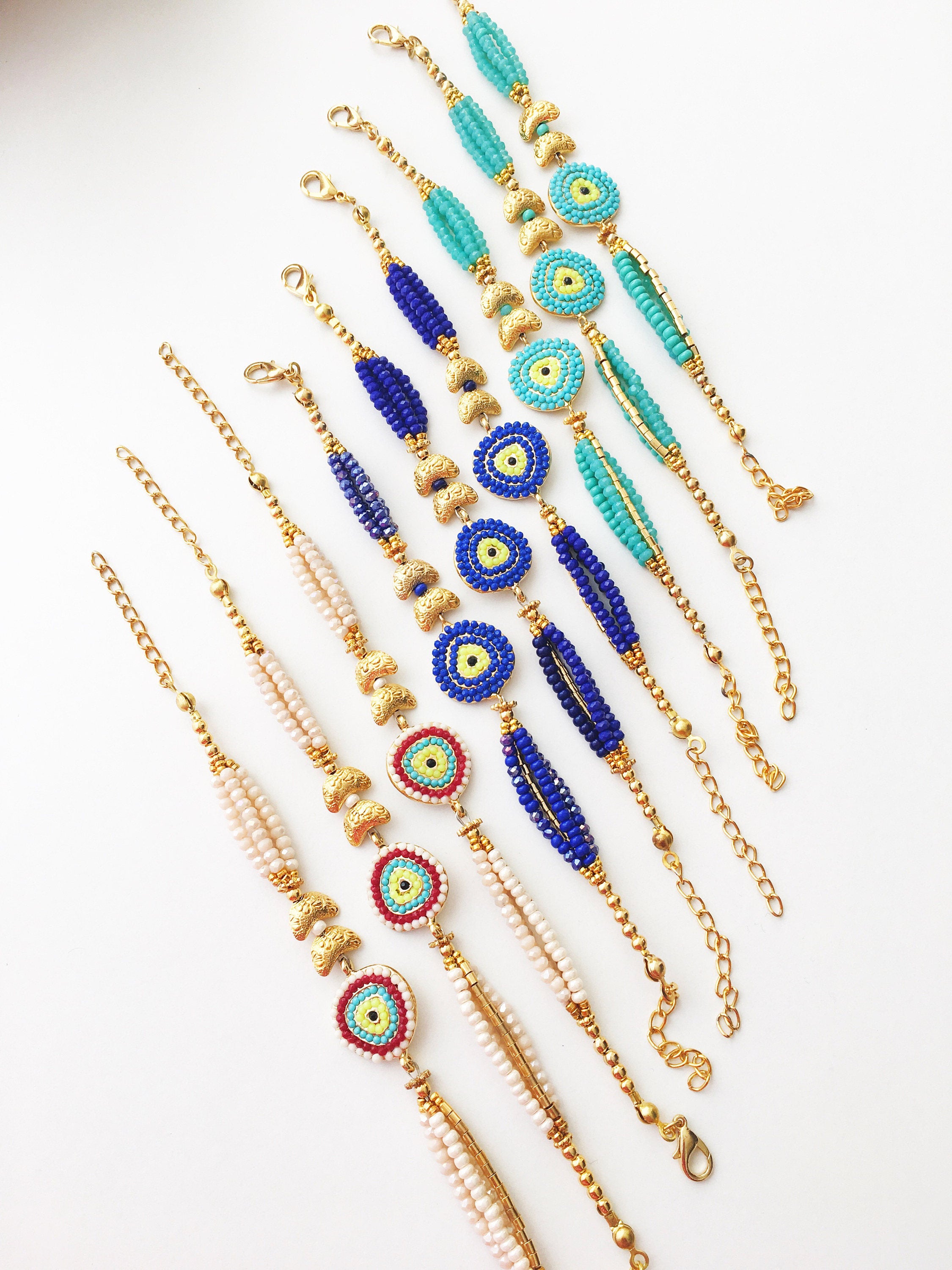 Handmade Seed Beads Evil Eye Bracelet featuring blue Miyuki beads and gold charm accents, symbolizing luck and protection.