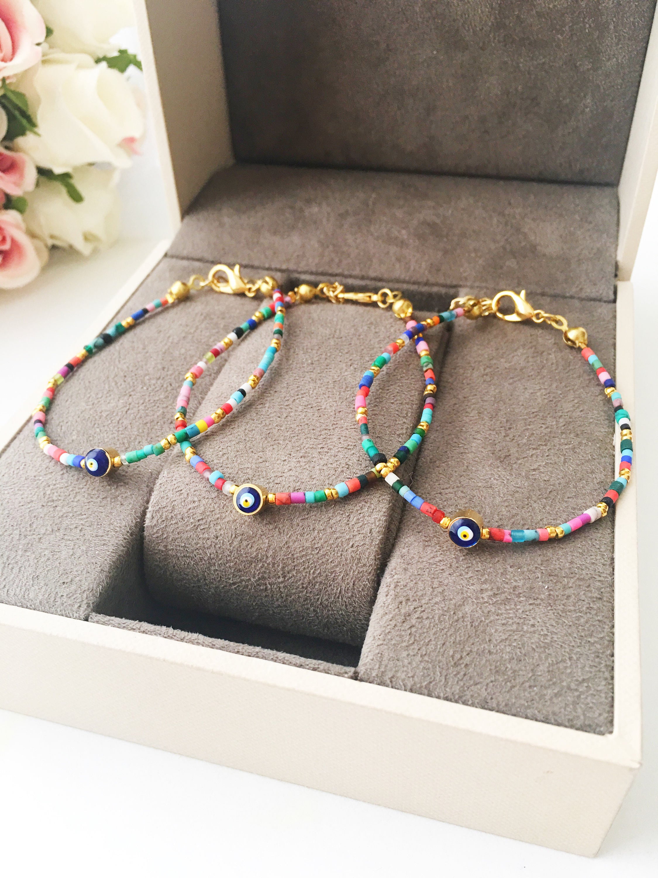 Handmade Seed Beads Evil Eye Bracelet featuring vibrant Miyuki beads and a protective charm, perfect for everyday wear.