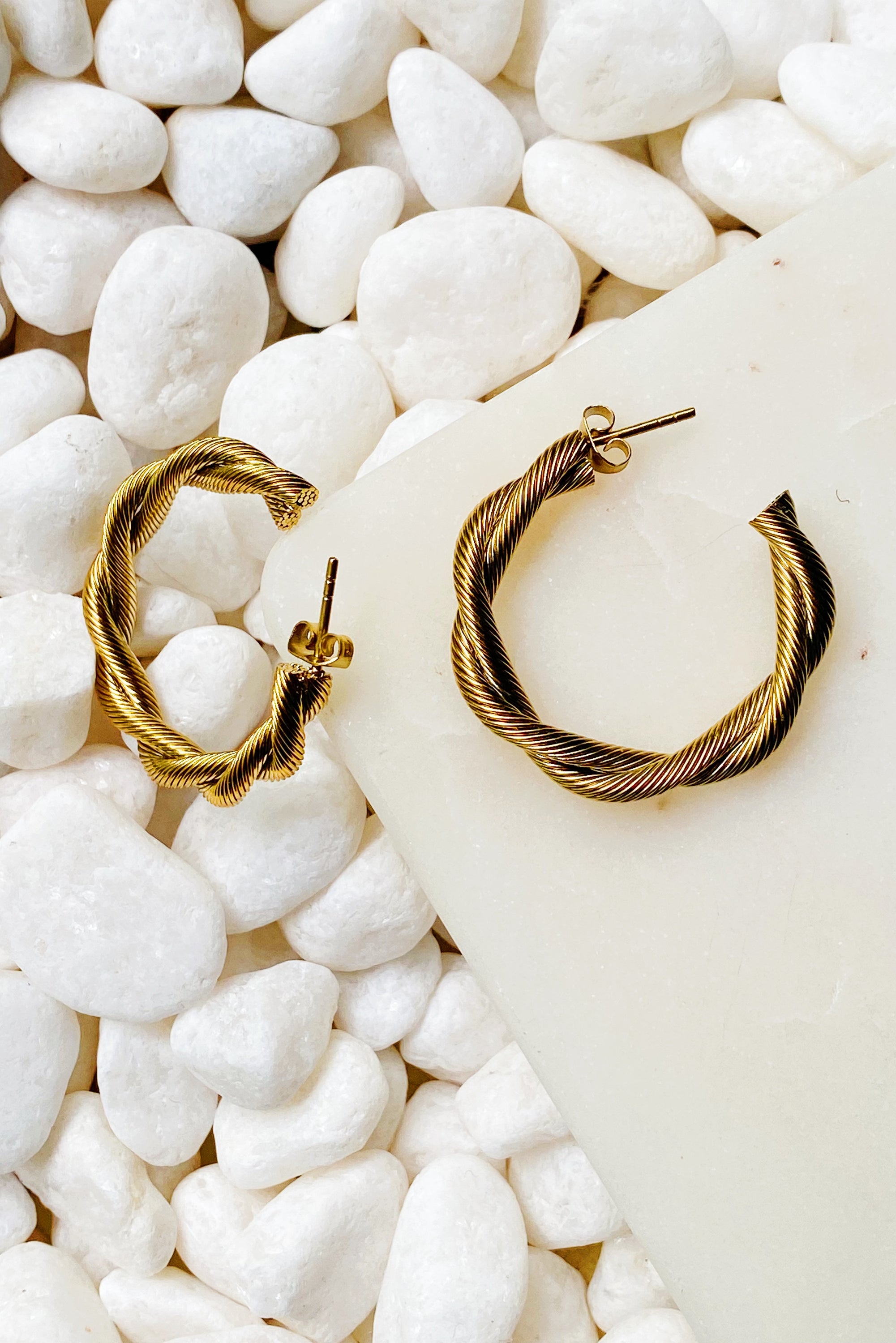 Sedona Twisted Hoop Earrings featuring a textured twisted tube design in gold plating.