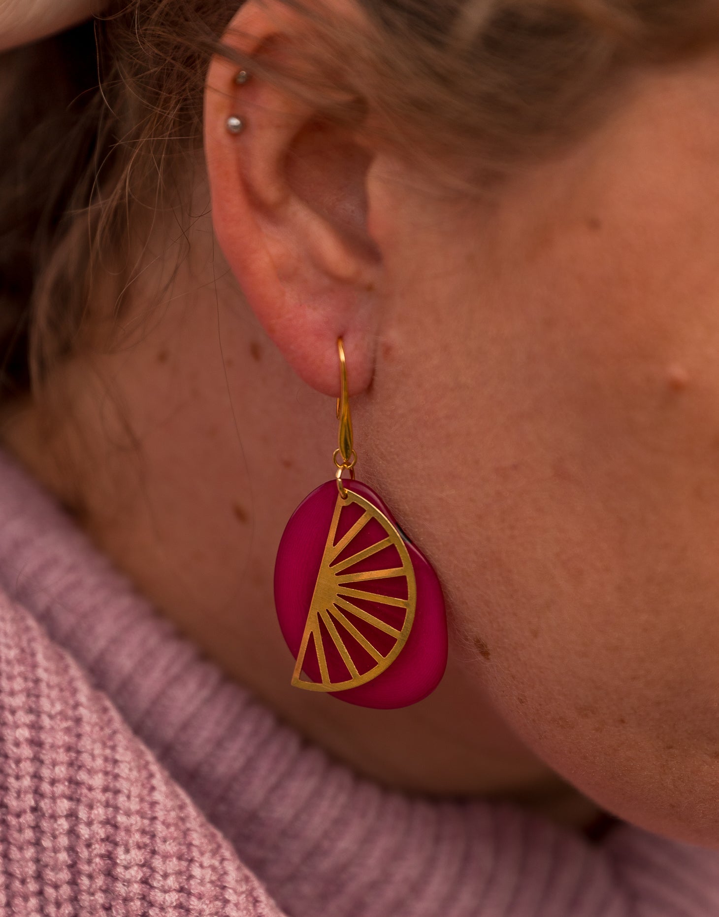 Segment Tagua Earrings featuring vibrant colors and raw brass charm, showcasing eco-friendly design.