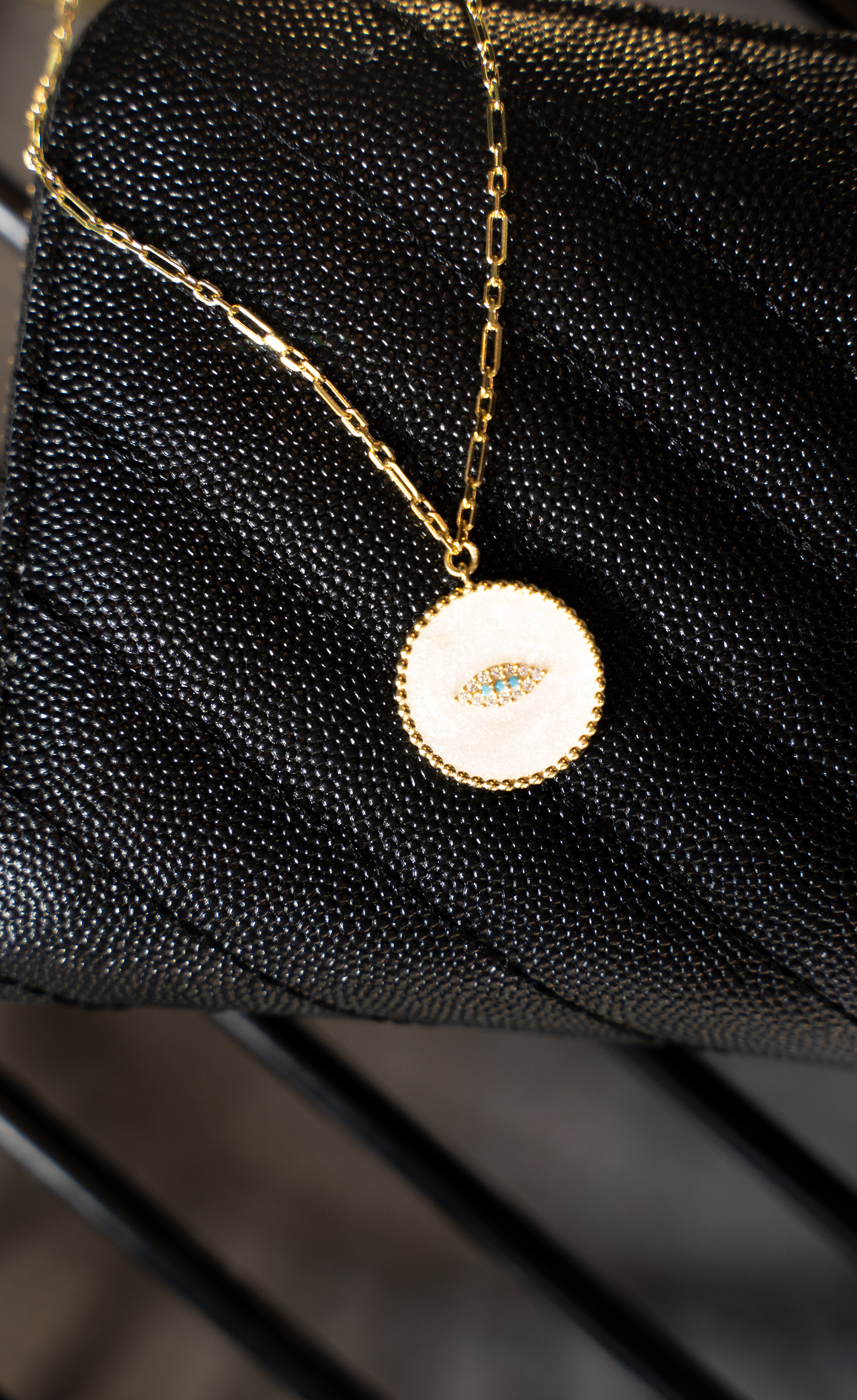 SEHR Necklace featuring an evil eye design with turquoise and cubic zirconia on a gold-plated sterling silver chain.